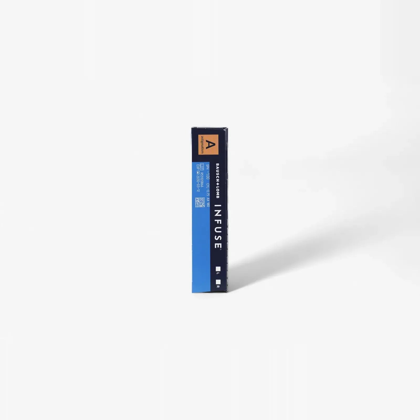 A blue and black rectangular box labeled B+L Infuse For Astig - 90Pk stands upright on a plain white background, casting a shadow to the right—a sleek package for premium daily contact lenses for astigmatism.