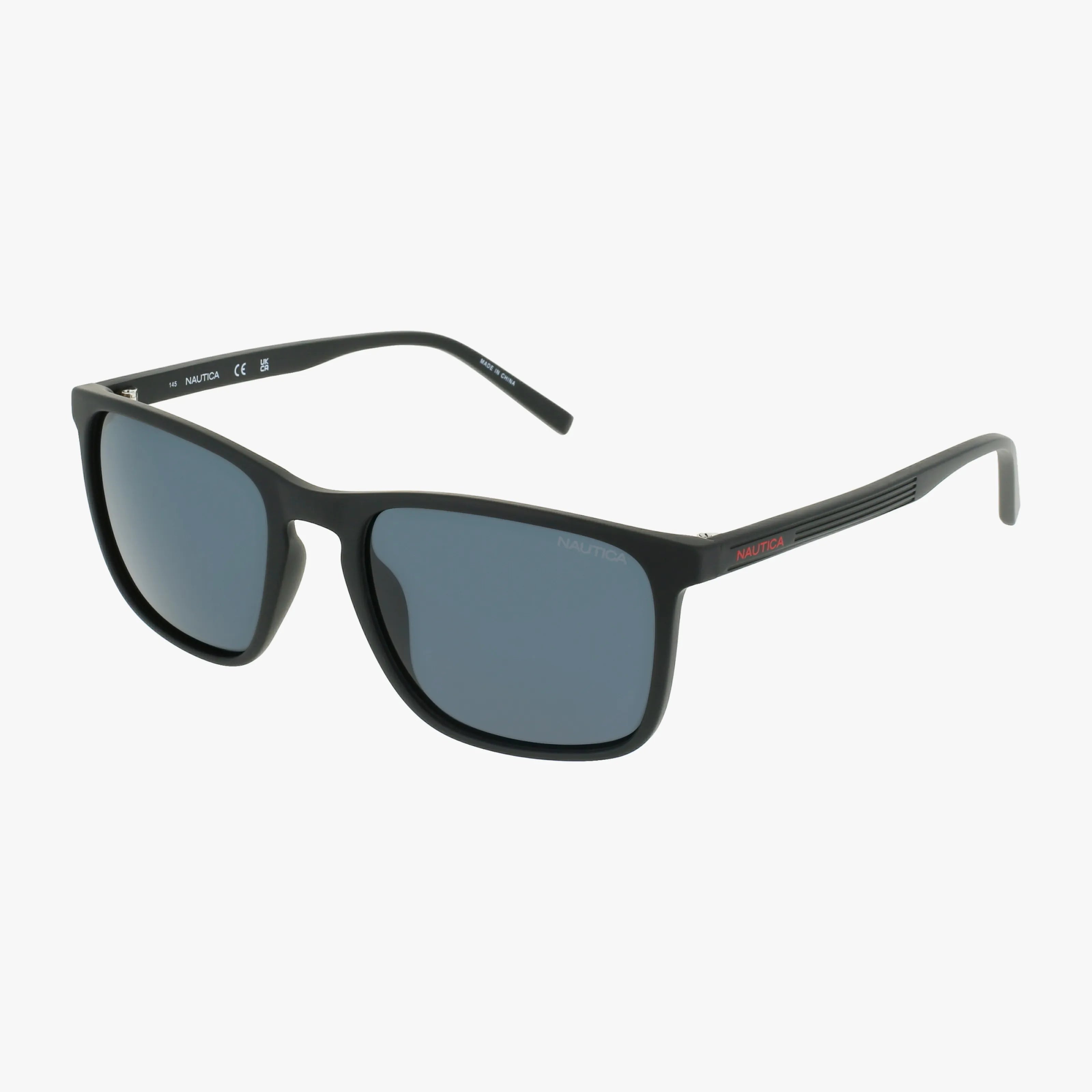 Black rectangular Nautica N6255S sunglasses with dark lenses and thin, subtly striped arms are shown on a plain white background. These bio-injected frames blend style and sustainability for eye protection that’s vision insurance eligible.
