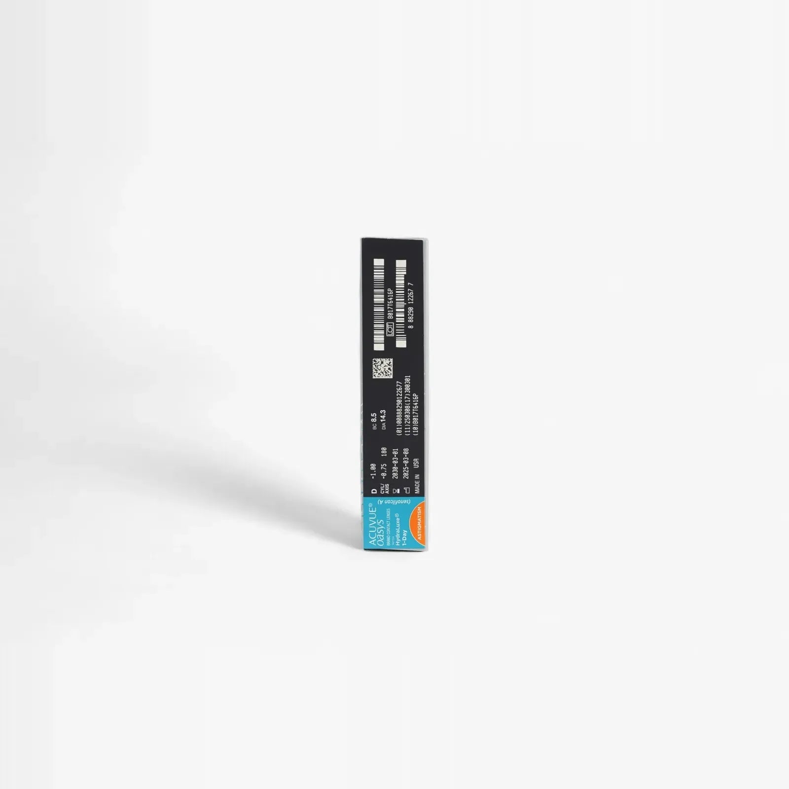 A black rectangular box stands upright on a white background, featuring white text, barcodes, and a blue-orange label for Oasys 1 Day For Astigmatism 90Pk contact lenses with HydraLuxe Technology.