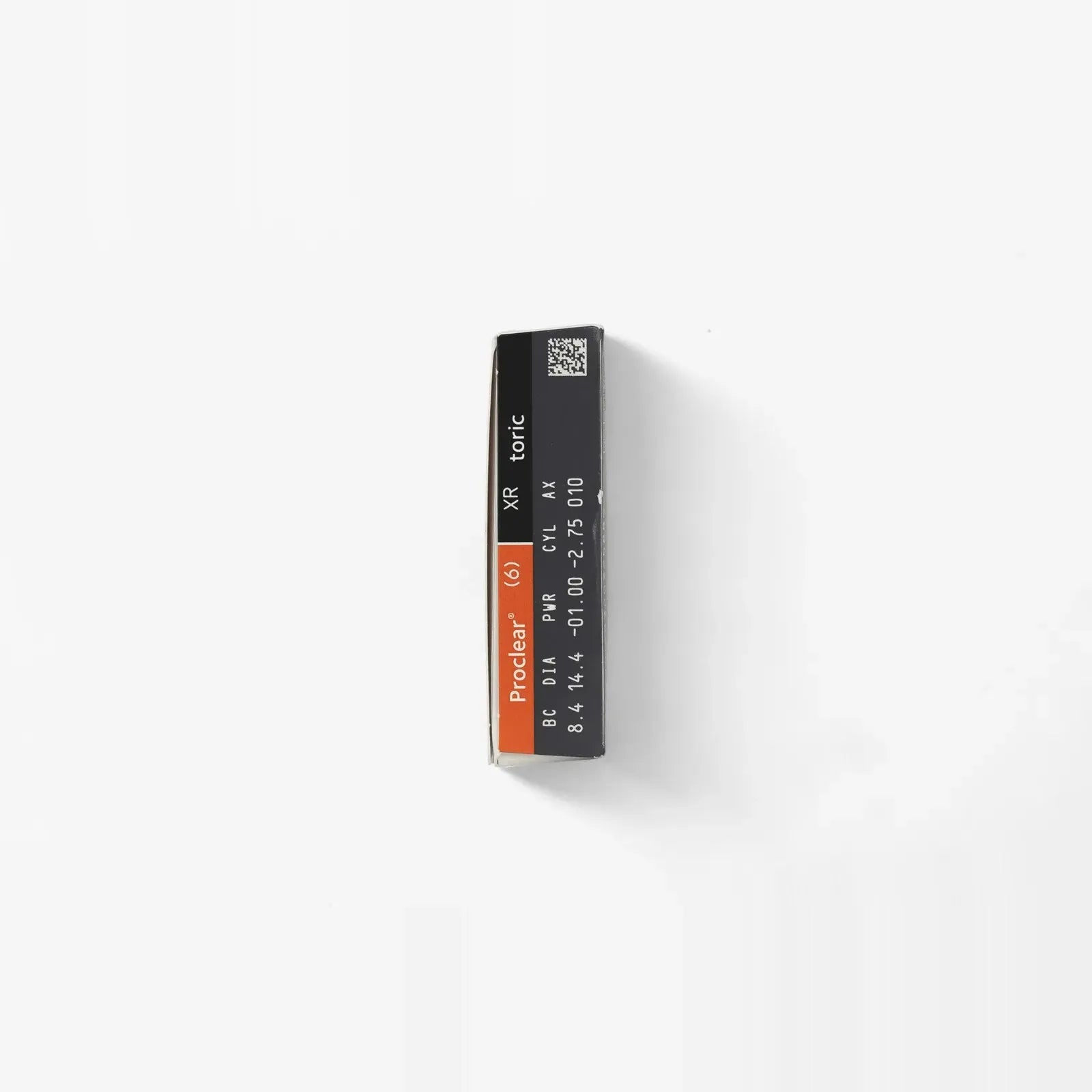 A rectangular black and orange Proclear Toric - 6 Pk box, labeled XR, 8.6/14.4, -10.00, and 25.00 for astigmatism lenses, sits on a white background.