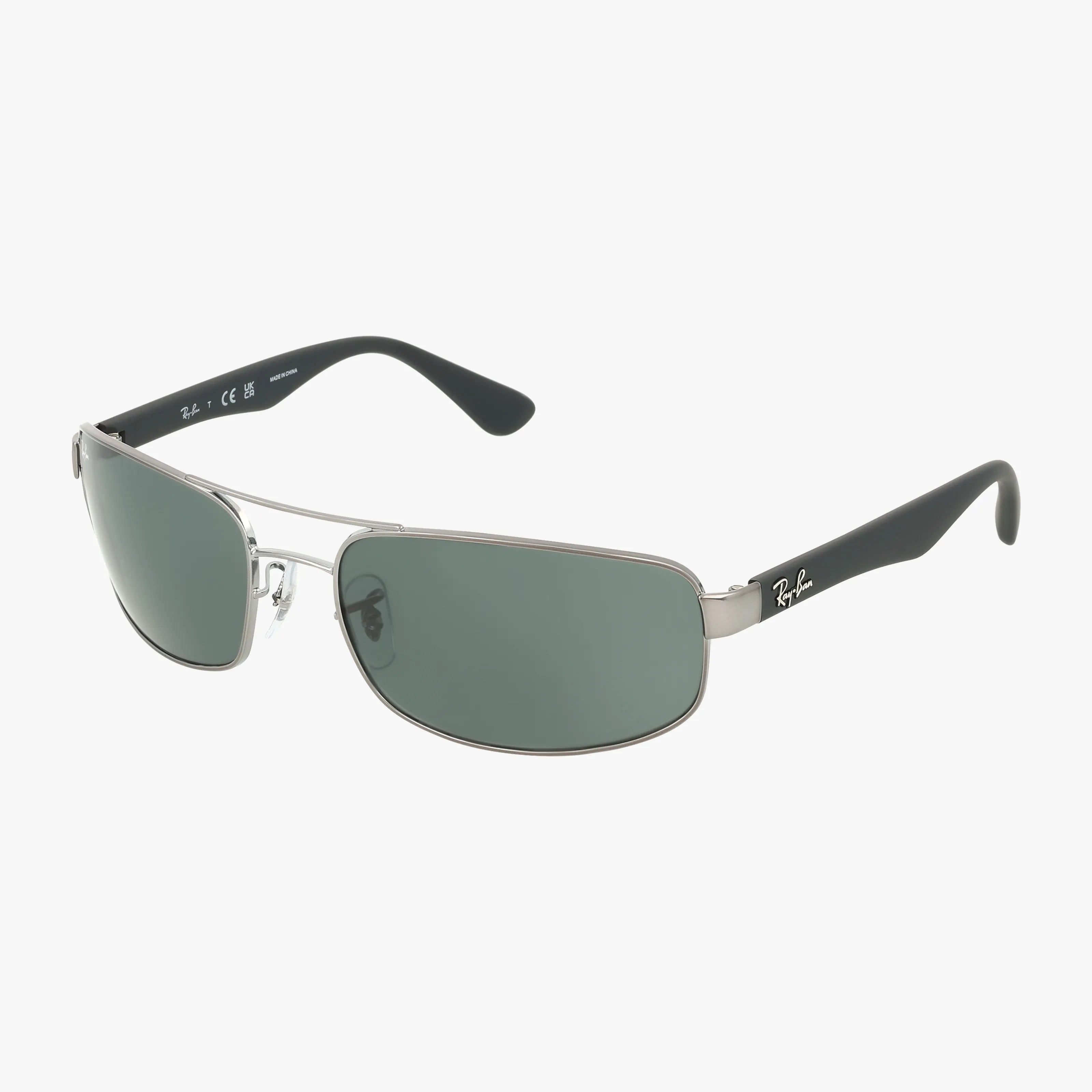 The RB3445 features stylish silver-framed aviator sunglasses with dark green lenses, black arms, and a white Ray-Ban logo on the right temple, set against a plain white background for a timeless look.
