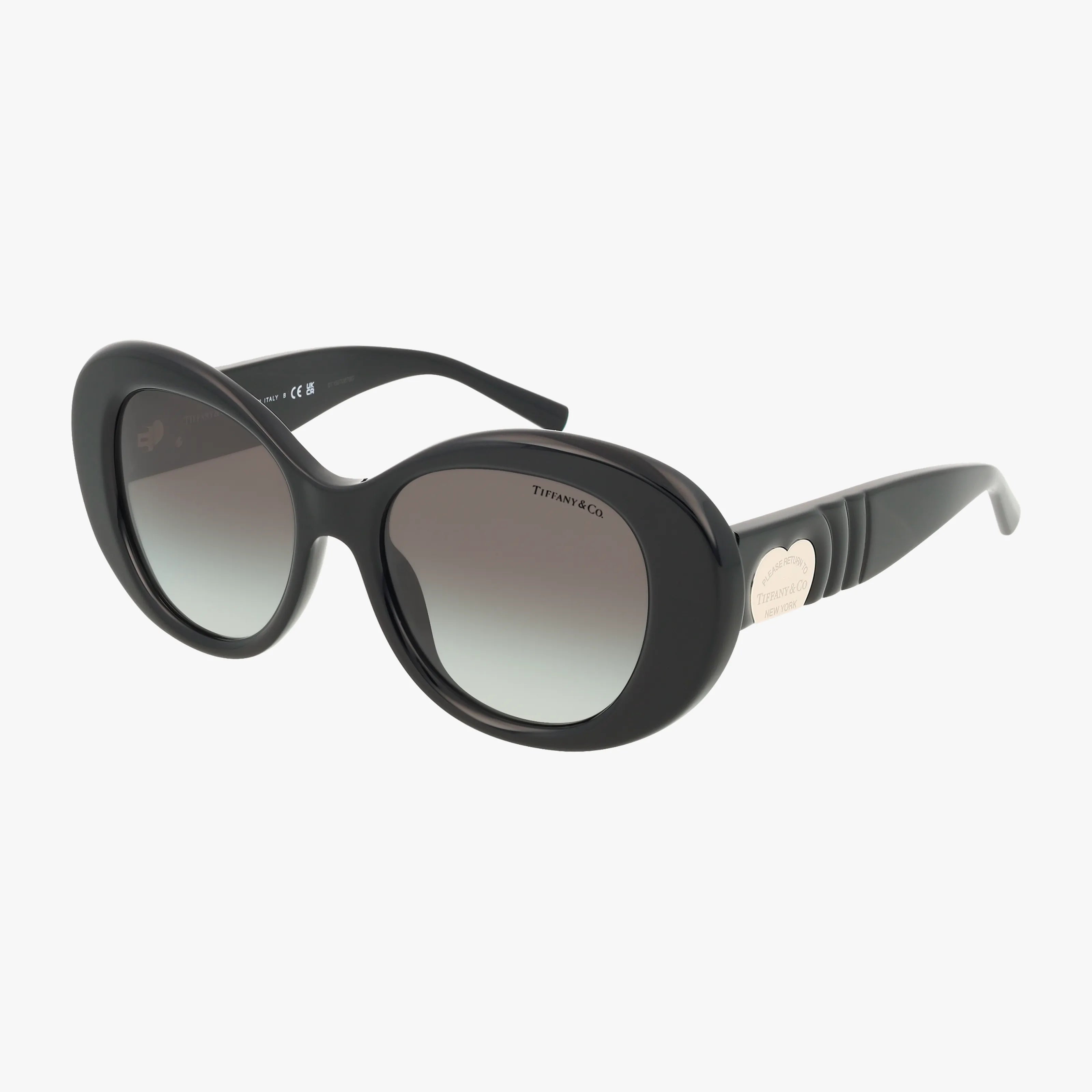TF4228 black oval sunglasses feature dark gradient lenses for advanced protection and a silver heart-shaped detail on the arms near the hinges, displayed against a white background.
