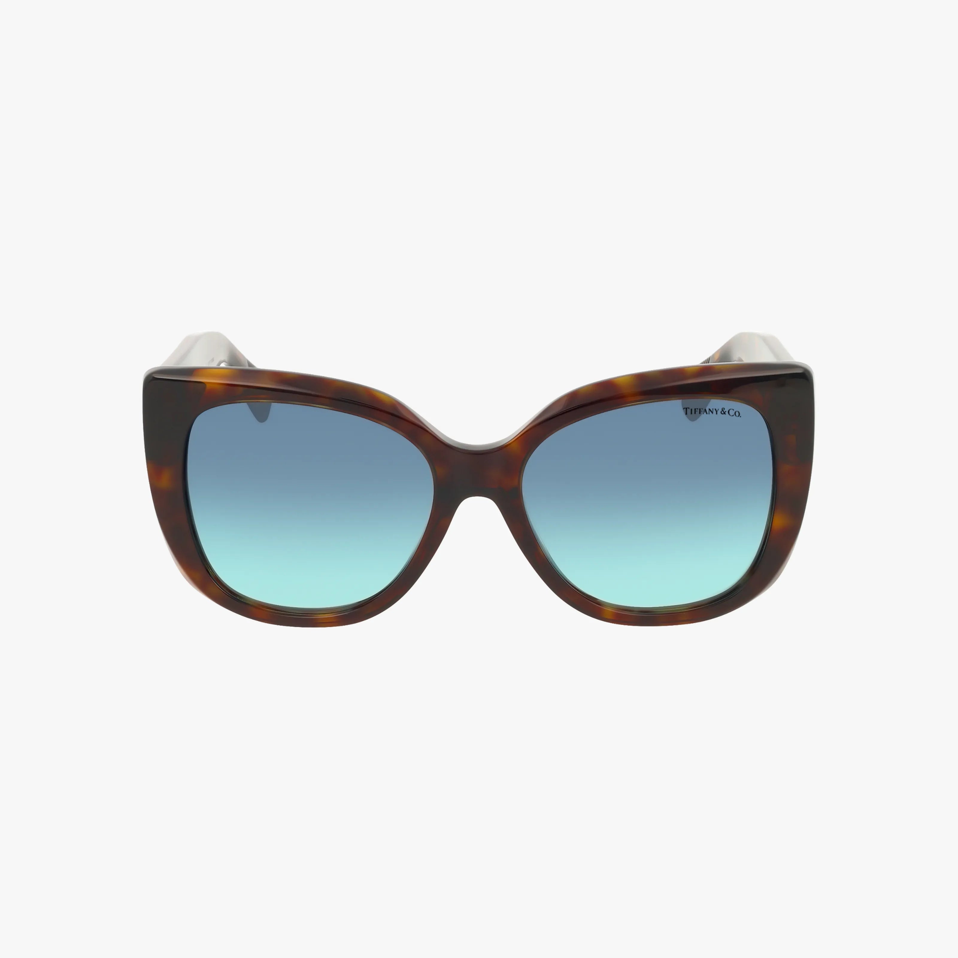 Front view of TF4229 tortoiseshell cat-eye sunglasses with gradient blue premium lenses, shown on a plain white background. The brand name appears subtly on the upper right lens, combining style with superior sun protection.