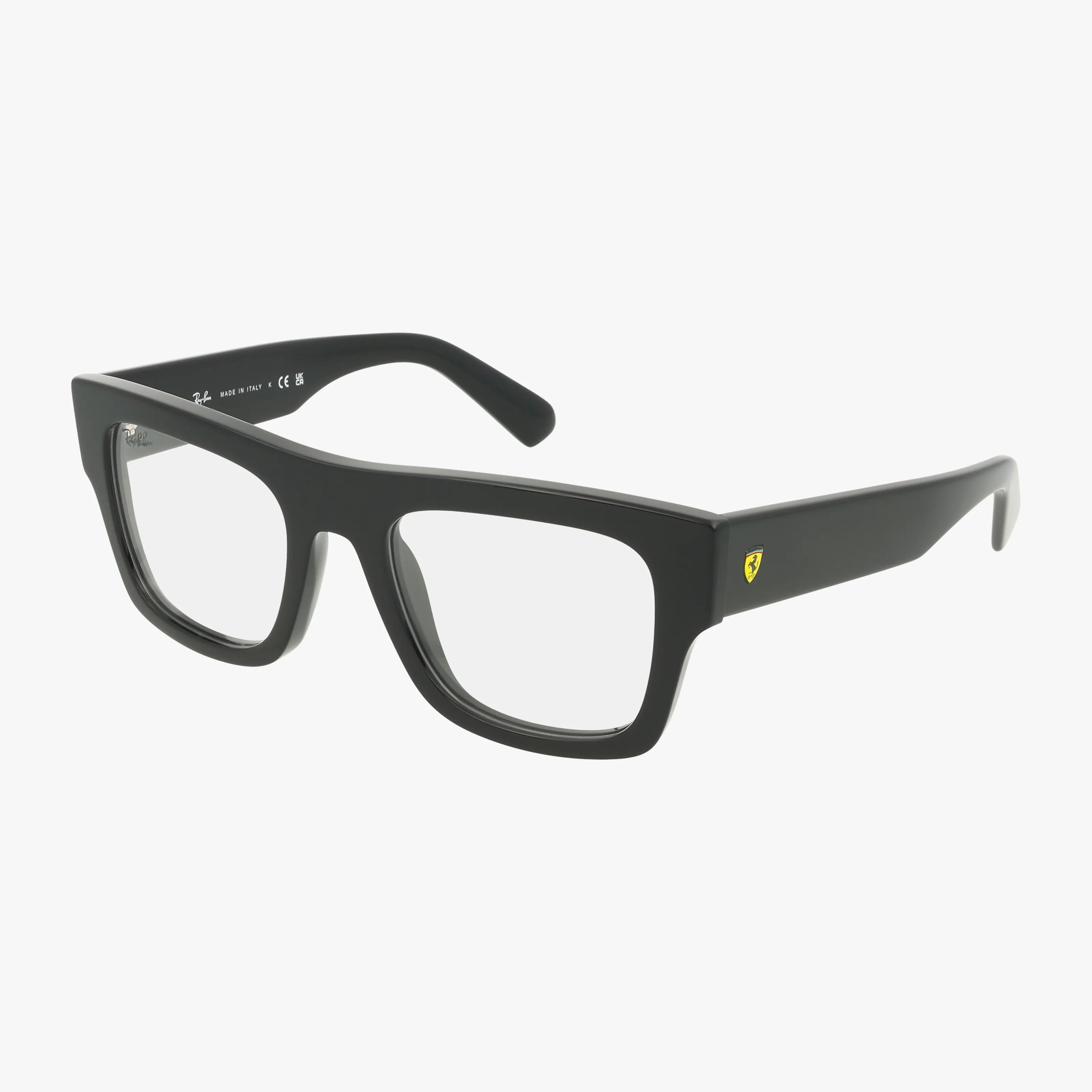 The RX5517M features black rectangular eyeglasses with thick, durable frames and a small yellow shield logo on the temple, displayed against a plain white background.