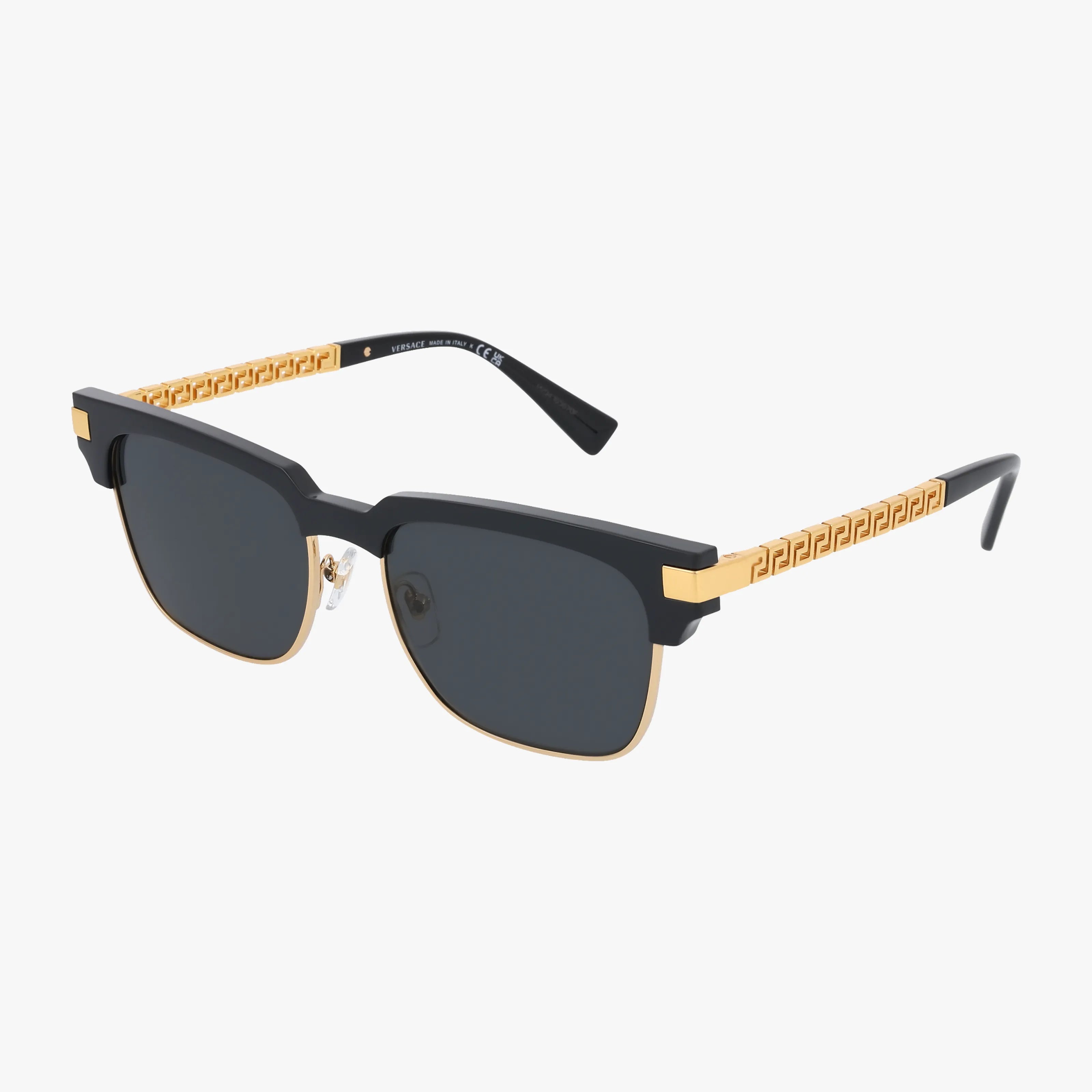 VE4447 sunglasses feature black and gold frames with dark rectangular lenses, elegant gold accents, a stylish Greek key pattern on the arms, and premium UV protection for your eyes.