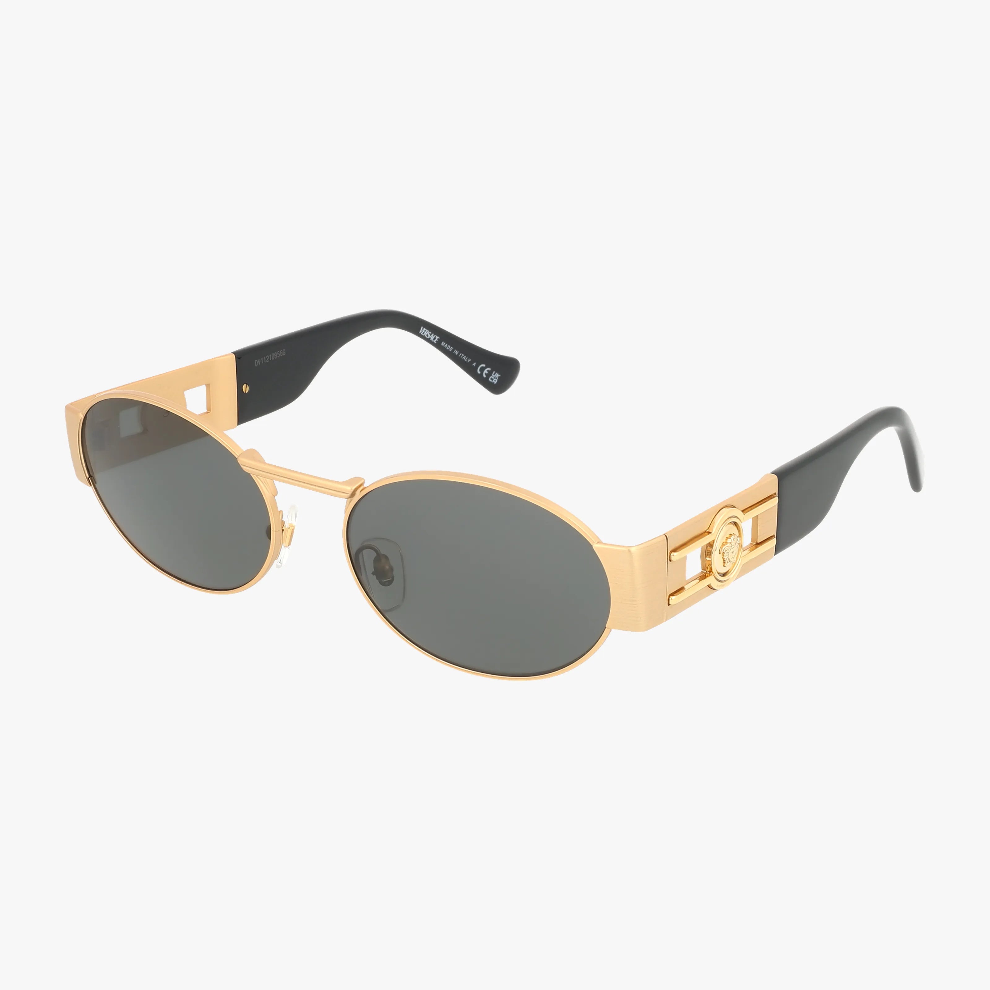 The VE2264 sunglasses feature an oval shape with dark lenses, a sturdy gold metal frame, black arms, and gold temples adorned with a prominent Medusa emblem on the sides.