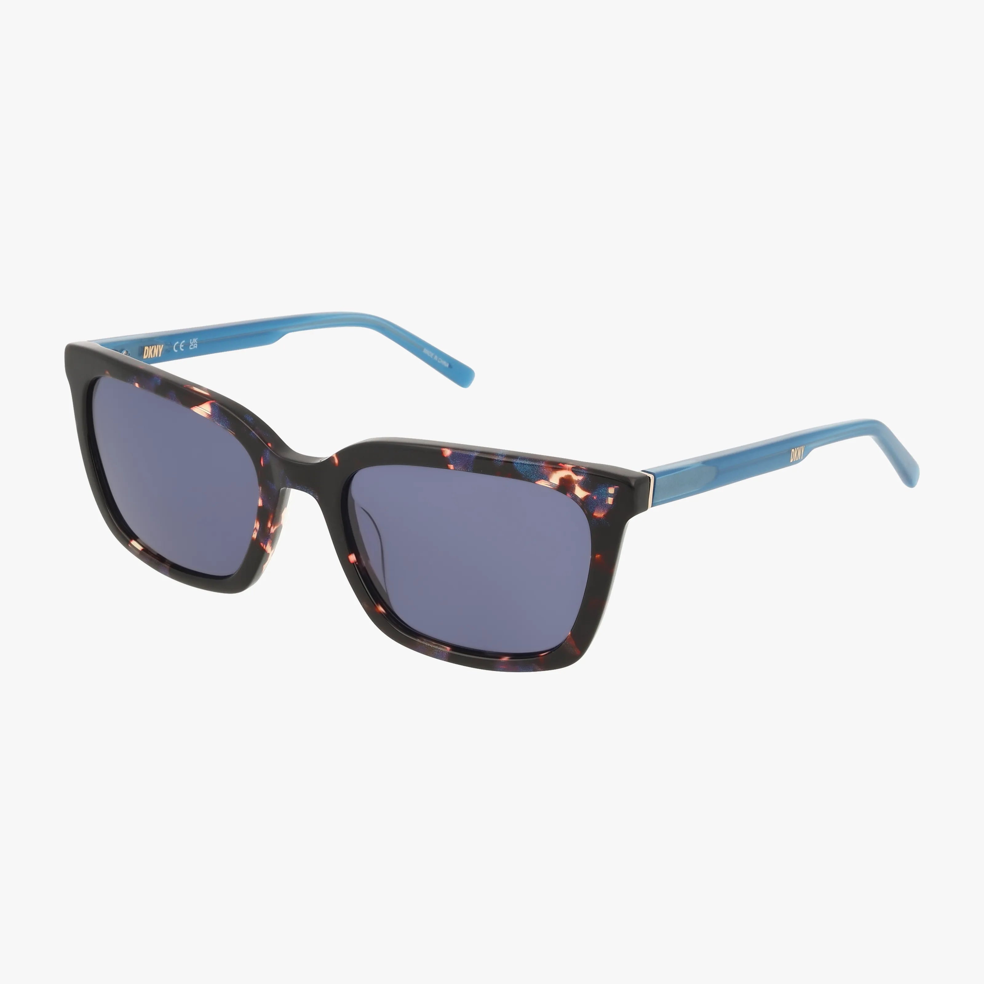 The DK546S sunglasses feature dark square lenses, black and tortoiseshell patterned frames, and blue arms, displayed on a white background.
