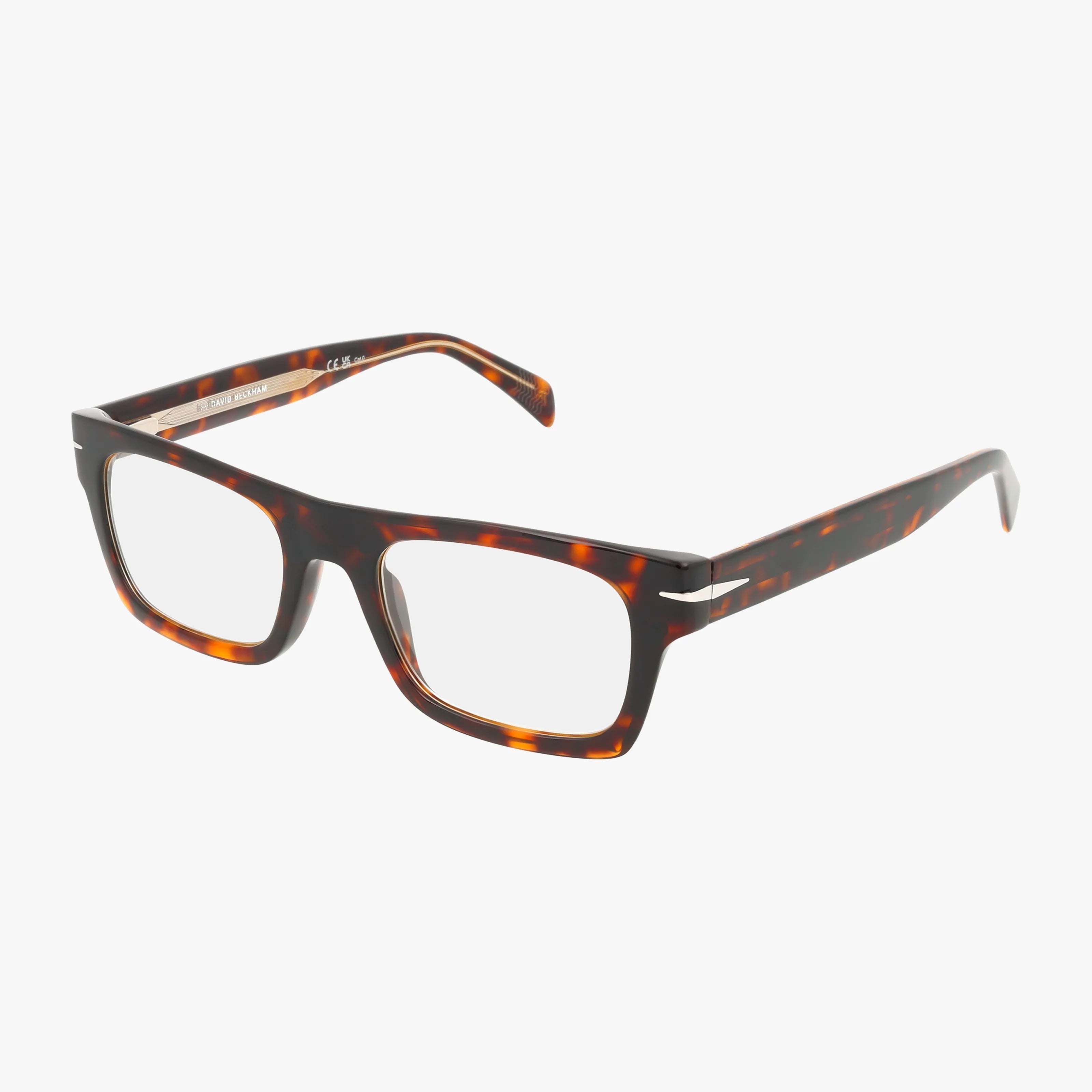 The DB 7129/CS features rectangular tortoiseshell eyeglasses with thick frames and clear lenses for vision benefits, displayed on a white background.