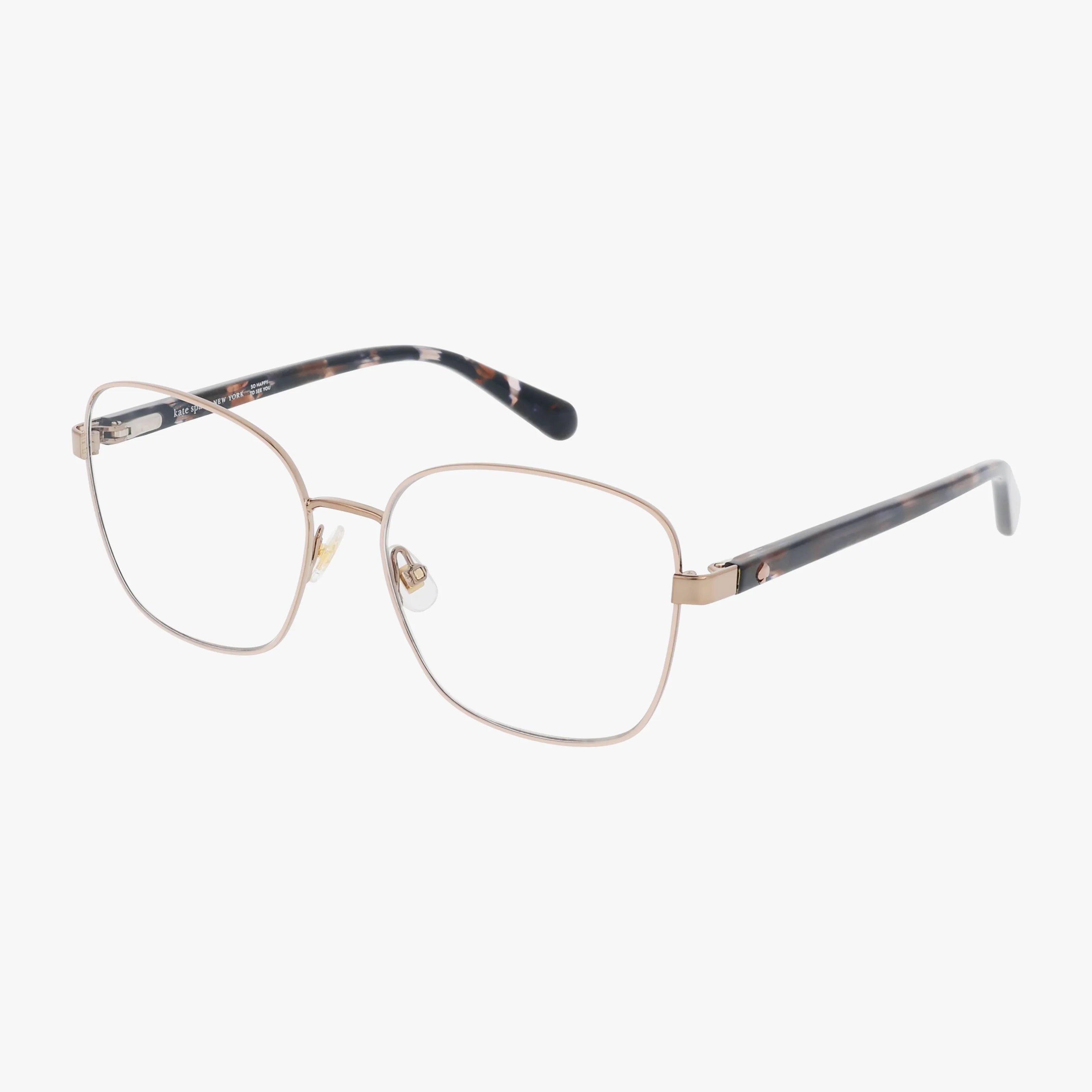 The KORA/G features gold wireframe eyeglasses with large rectangular lenses and tortoiseshell-patterned arms, crafted in a lightweight frame and shown against a plain white background.