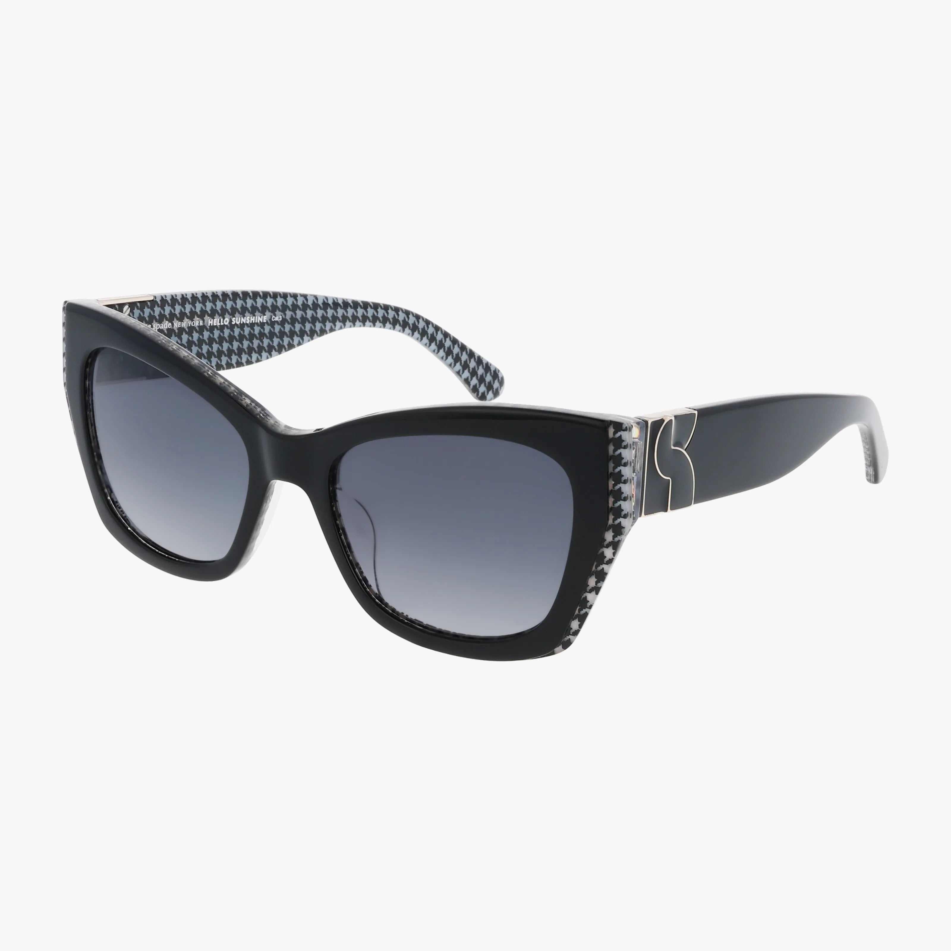 JAYDA/G/S cat-eye sunglasses feature gradient dark lenses, a houndstooth pattern on the inner arms and front edges, and a gold K detail on the temples—shown against a white background. Perfect for stylish online shoppers.