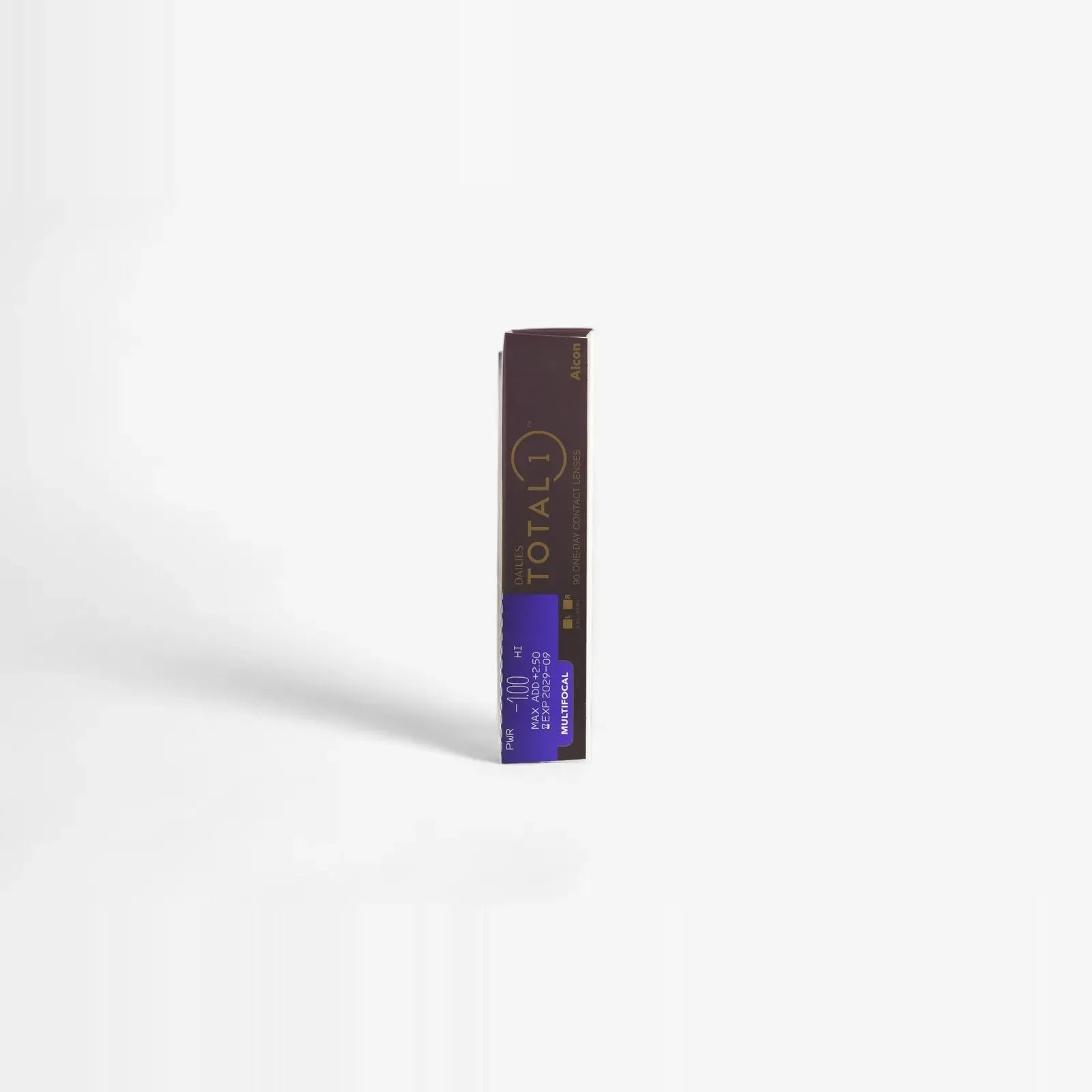 A brown and purple rectangular box labeled Dailies Total 1 Multifocal - 90 Pk daily disposable contact lenses stands upright on a plain white background, casting a soft shadow to the left.