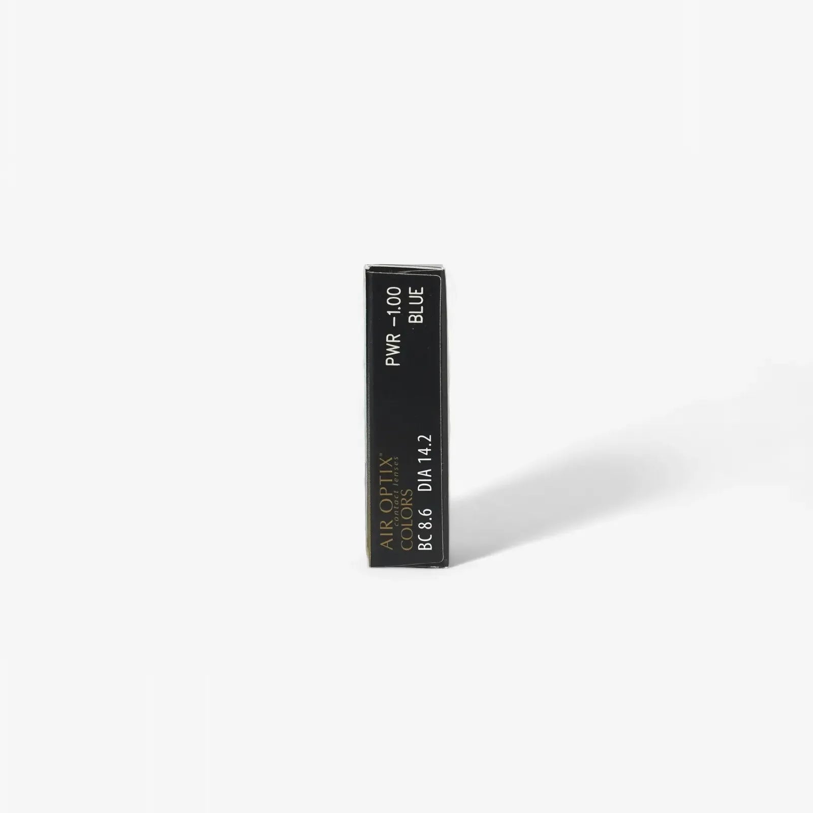 A black rectangular box labeled PWR -1.00 BLUE and Air Optix Aqua Colors - 6 Pack stands upright on a white background, casting a soft right shadow—featuring breathable, comfortable colored contact lenses.