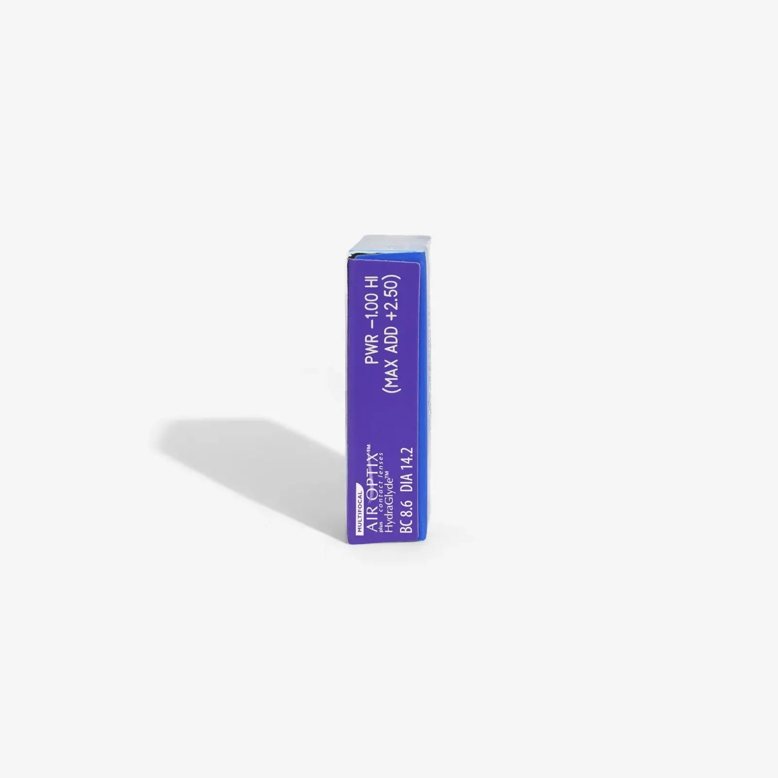 A single blue rectangular Air Optix Hydraglyde Multi 6Pk box stands upright on a white background, casting a shadow to the left. The packaging displays prescription details and indicates monthly contact lenses.