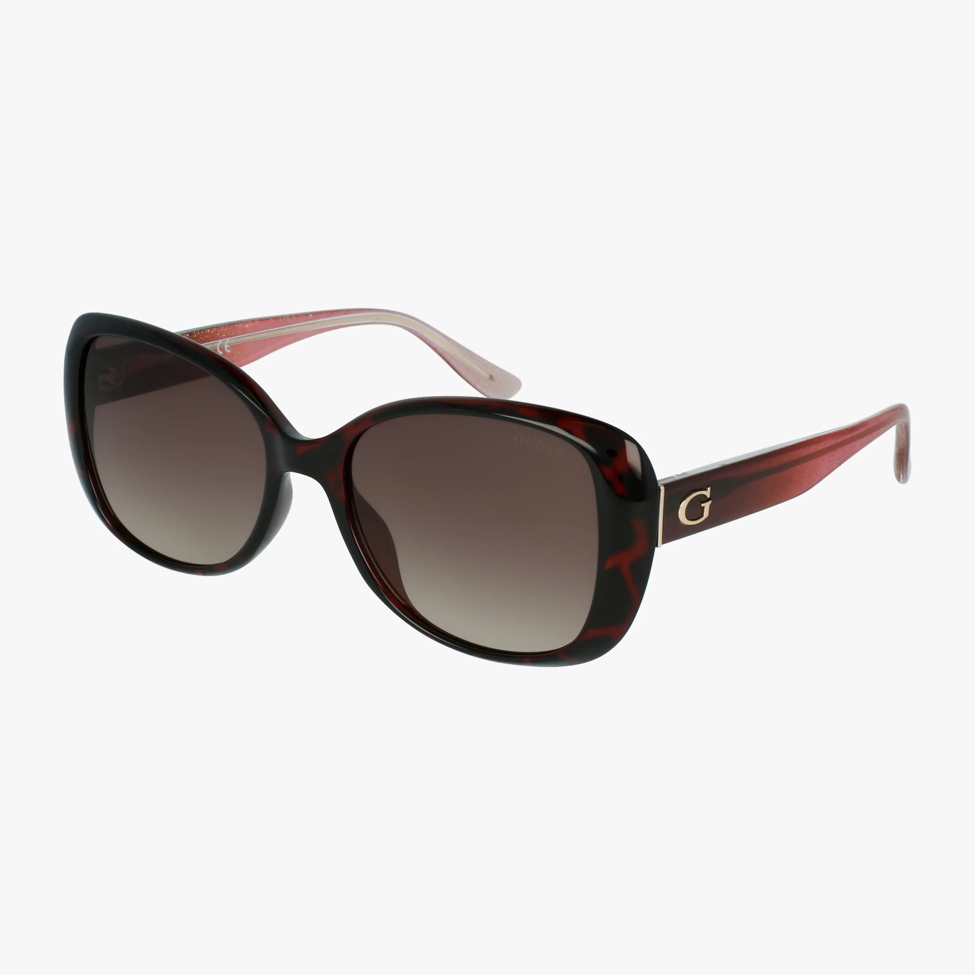 The GU7554 features oversized cat-eye sunglasses with dark gradient lenses, a tortoiseshell lightweight frame, gold G logo on the temples, and translucent reddish-pink arms.