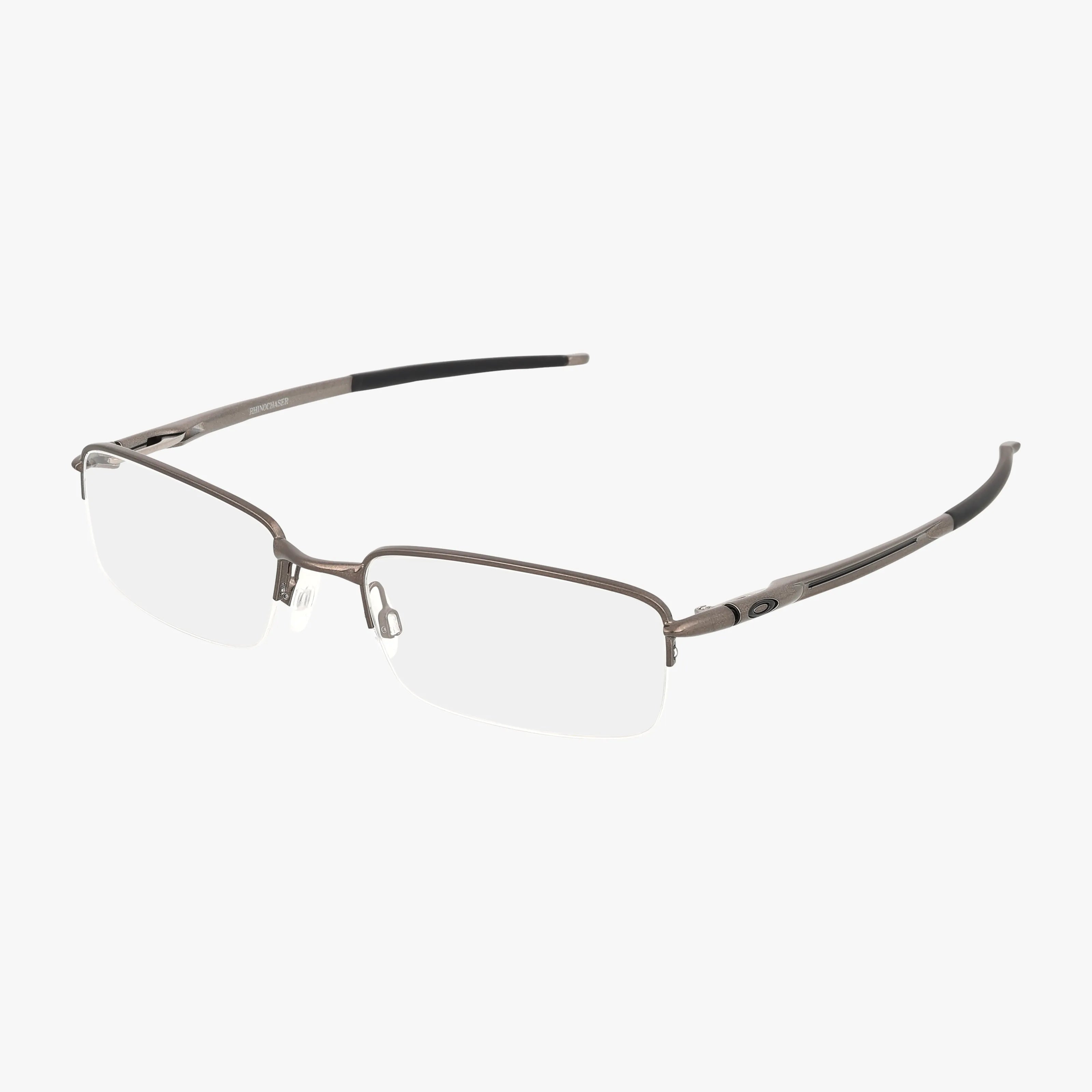 The OX3111 is a pair of rectangular, rimless eyeglasses with a thin metallic gray frame and black temple tips, combining modern style and comfort for everyday wear on a white background.