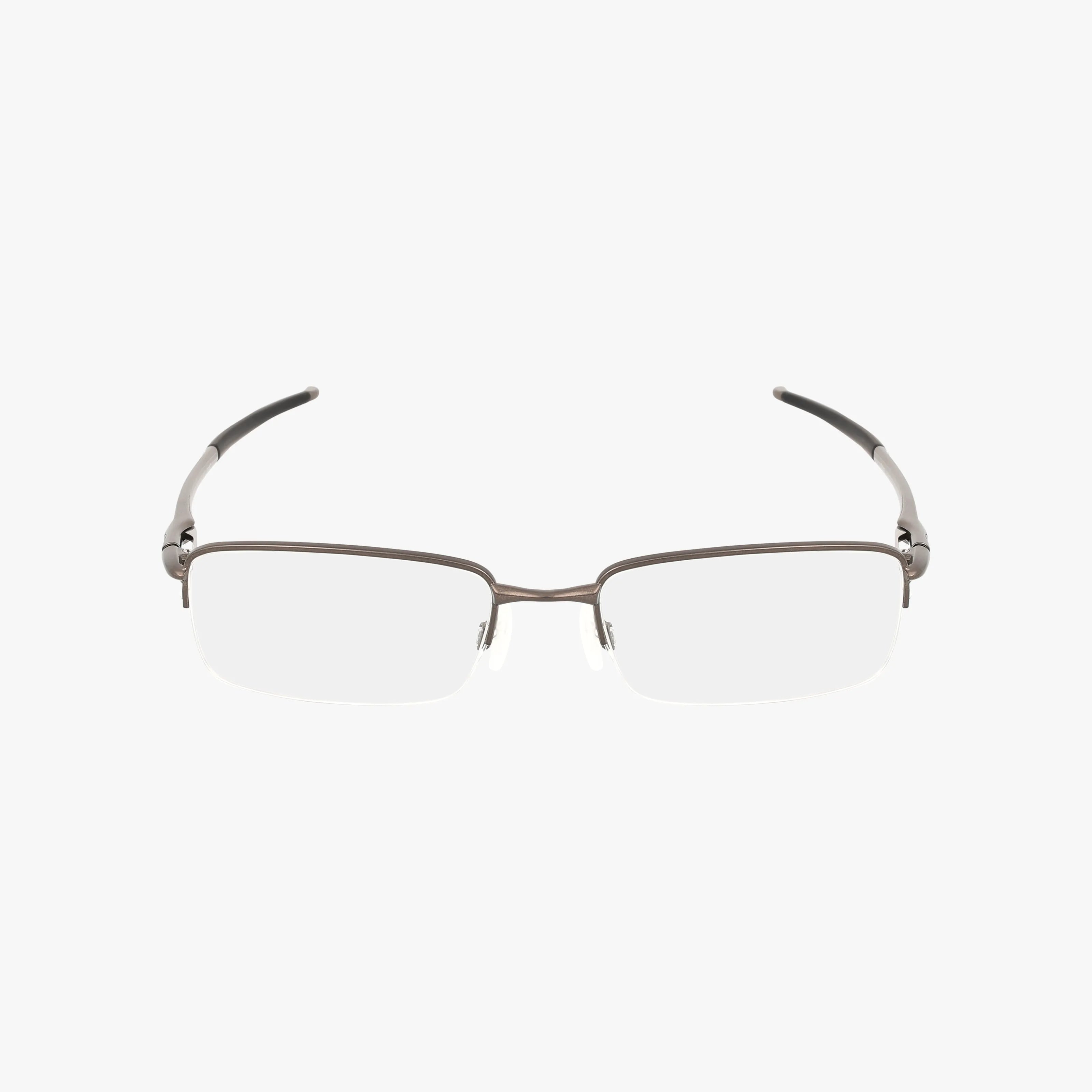 The OX3111 features rectangular, half-rim eyeglasses with a thin metal frame and black temple arms for a sleek, modern look. Comfortable and stylish, they are shown against a plain white background.