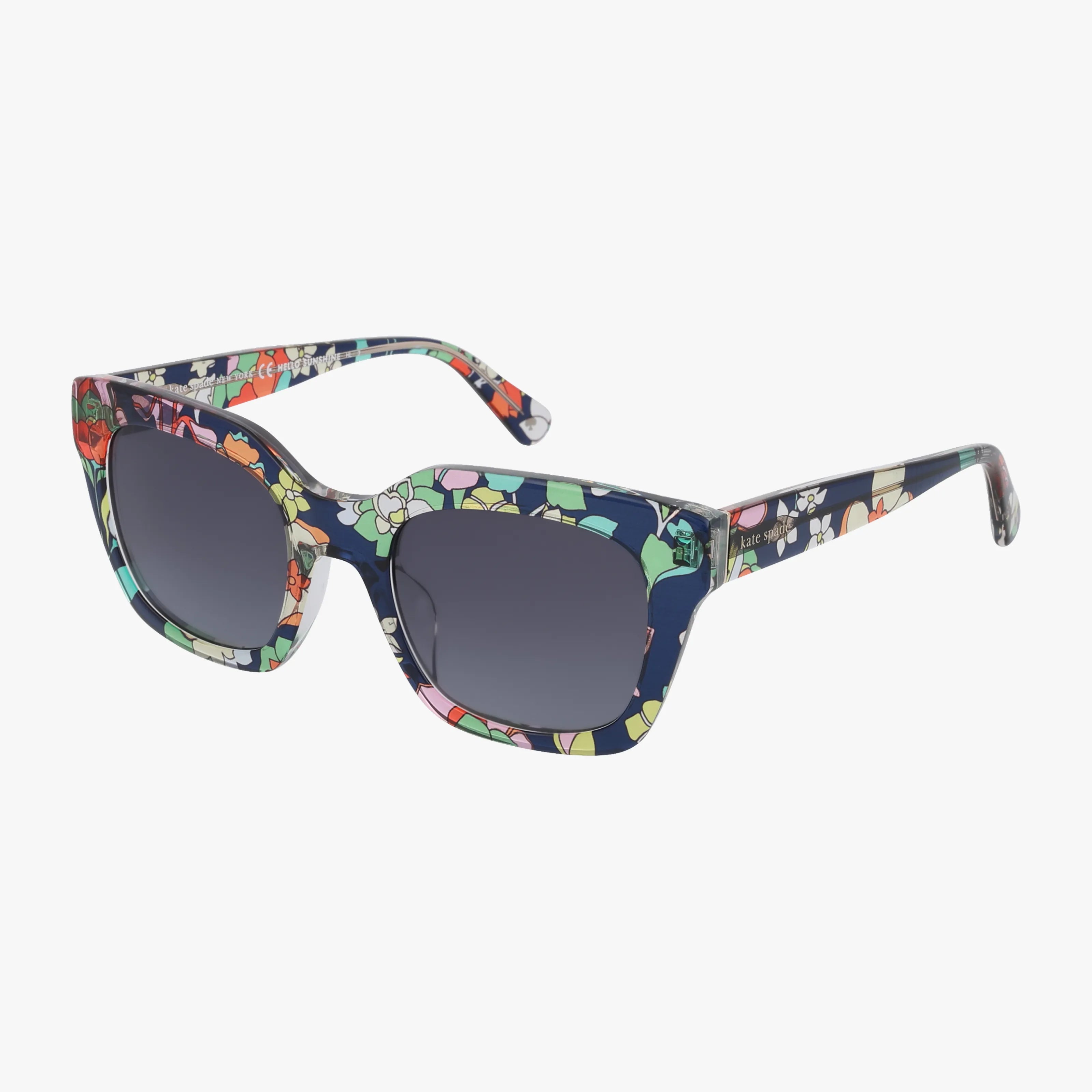 The CAMRYN/S sunglasses feature square, navy blue frames with premium lenses and a colorful floral pattern. Their durable design includes wide arms, also adorned with the vibrant floral print.