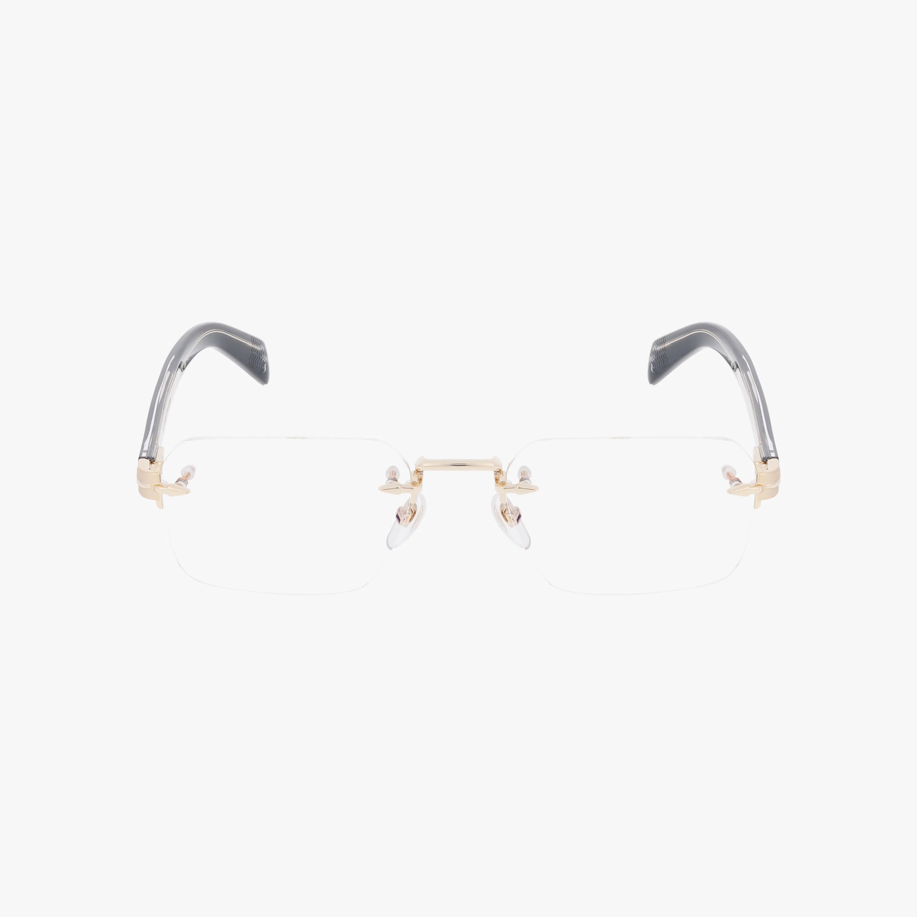 The DB 7116 is a pair of rimless eyeglasses with gold metal arms and bridge, clear lenses, and black temple tips, showcased on a white background to emphasize their quality craftsmanship and lightweight design.