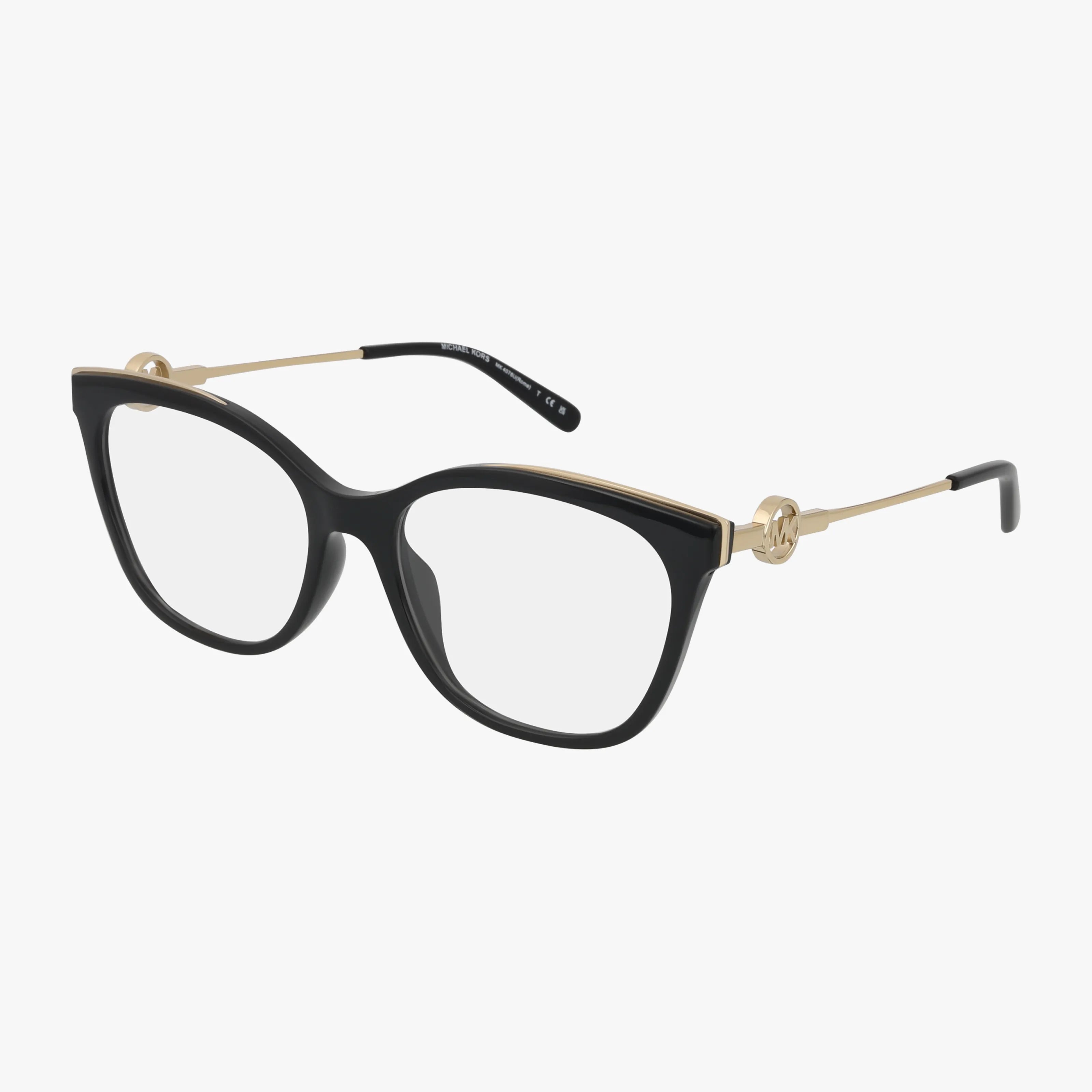 The MK4076U eyeglasses feature bold black cat-eye frames, thin gold metal arms with circular hinge accents, and offer optional blue light lenses. Michael Kors eyewear is showcased against a plain white background.