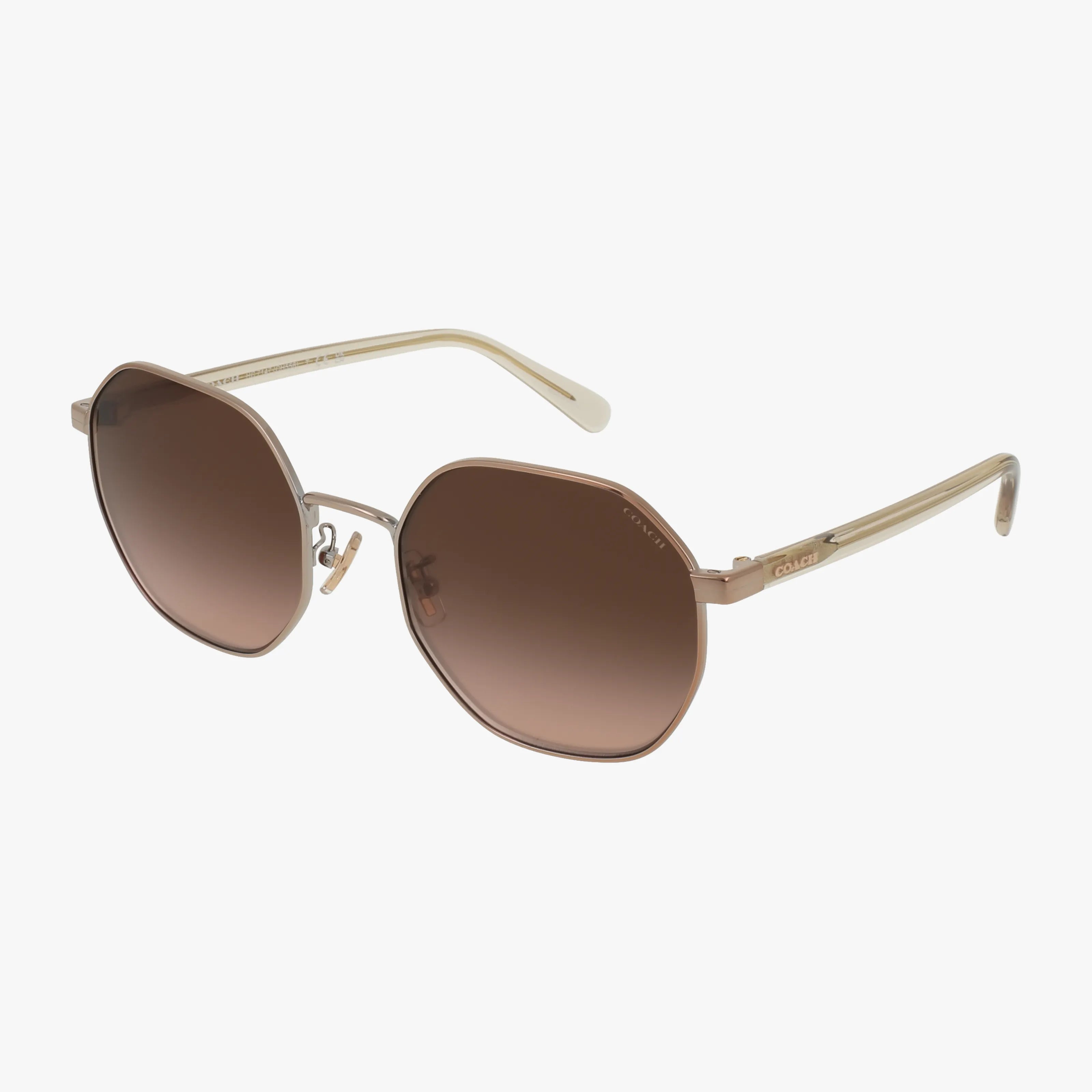 The HC7147 sunglasses feature gold hexagonal frames, brown gradient lenses, and slim arms. Displayed on a plain white background, the image shows both the front and side views.