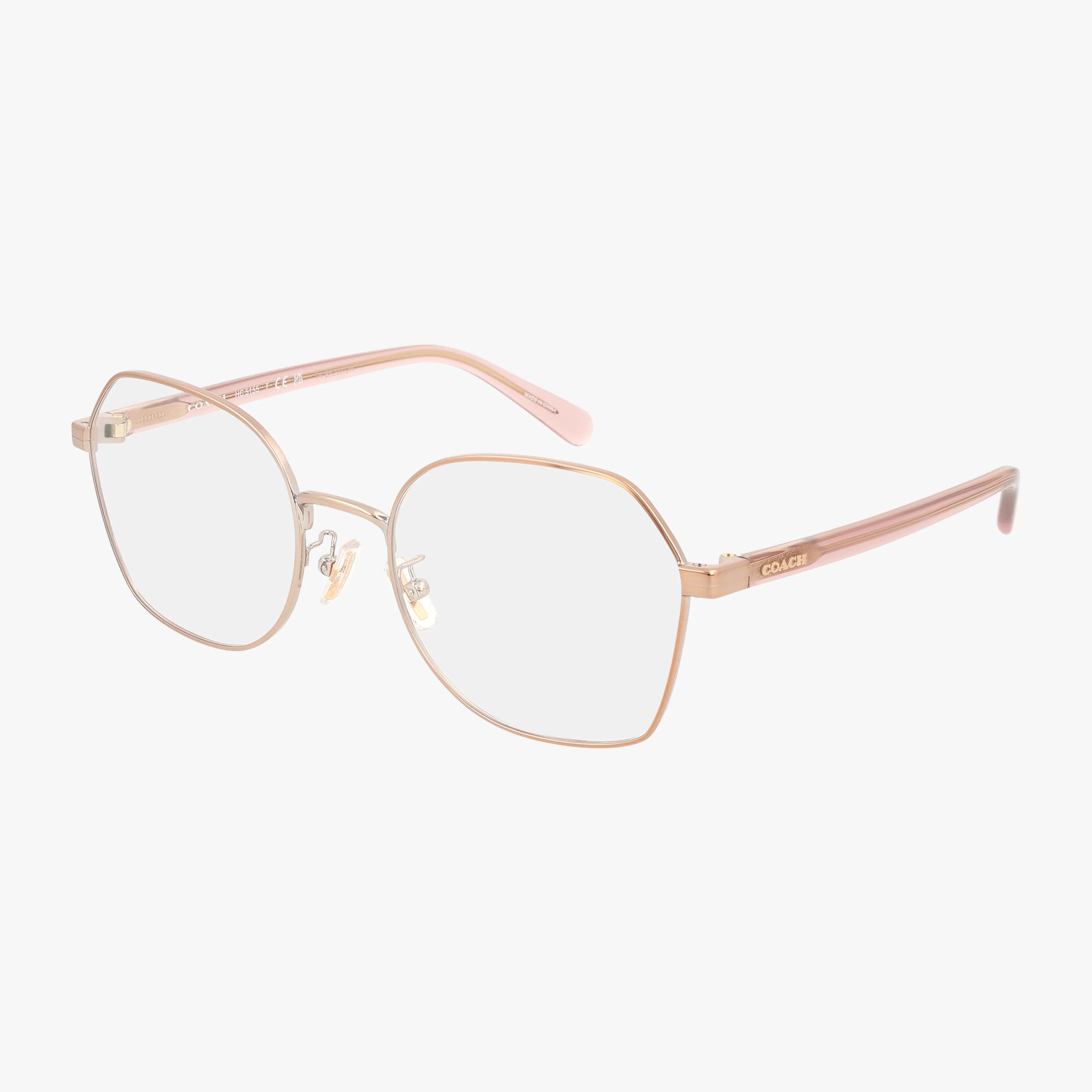 The Coach HC5155 eyeglasses feature gold-rimmed geometric frames, clear lenses, and pink arms with the Coach logo on the sides, displayed on a white background.
