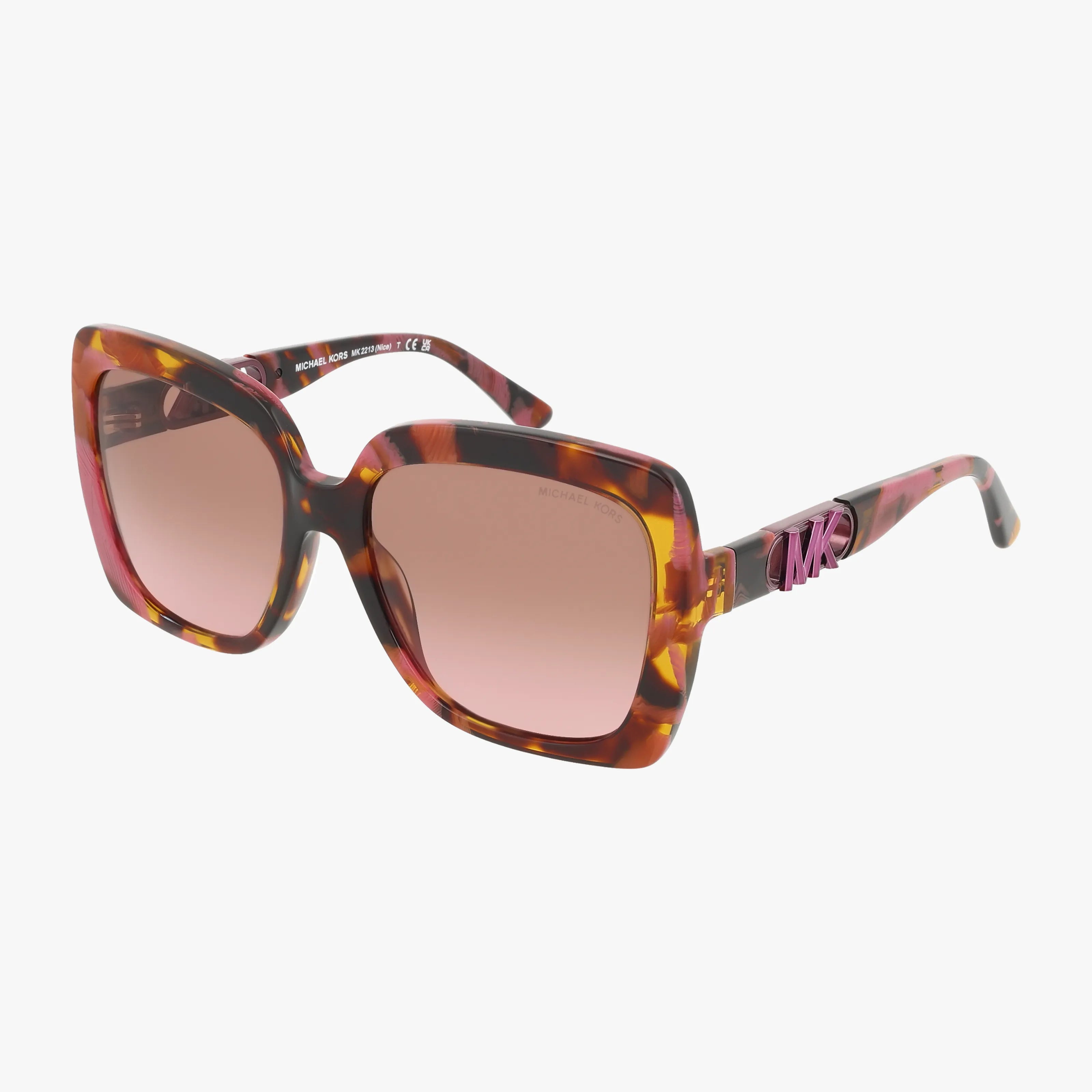 The MK2213 sunglasses by Michael Kors feature oversized square frames in brown and amber tones, pink-accented arms, brown gradient lenses, and signature MK branding on the temples for a chic designer look.