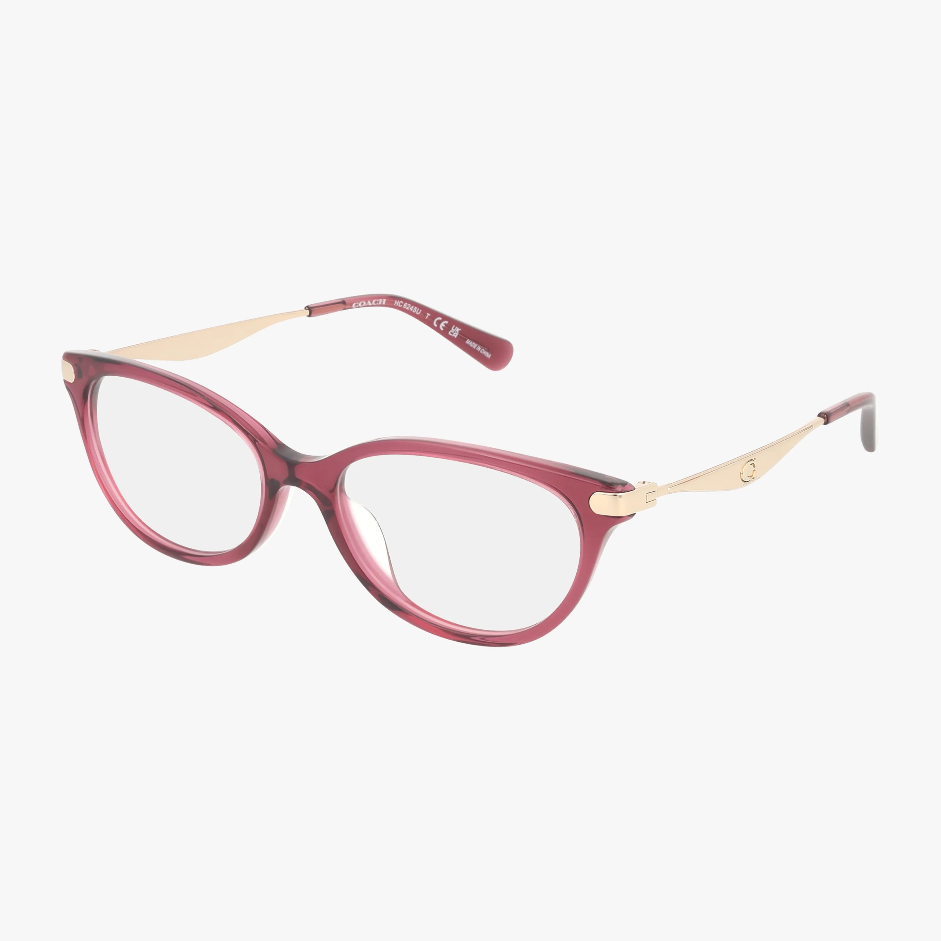 The HC6245U eyeglasses showcase oval, translucent burgundy frames with gold-toned metal arms, offering a stylish and well-balanced design against a plain white background.