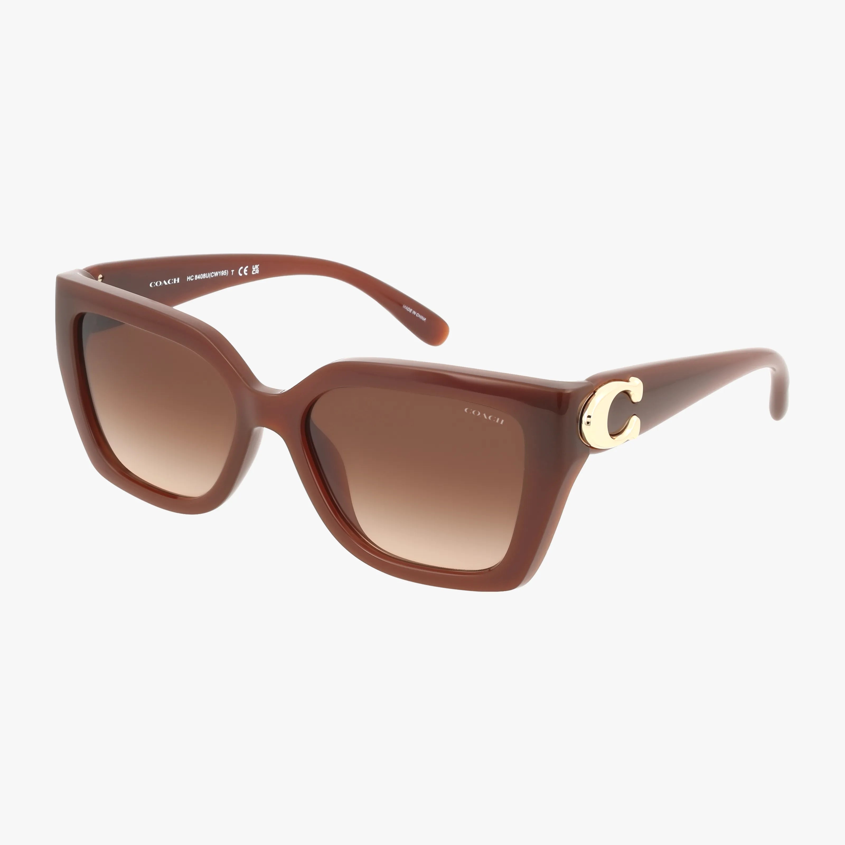 The HC8408U features brown oversized square frames with gradient brown lenses and a large gold C logo on the thick left temple. These chic sunglasses combine stylish looks, advanced protection, and lightweight comfort.