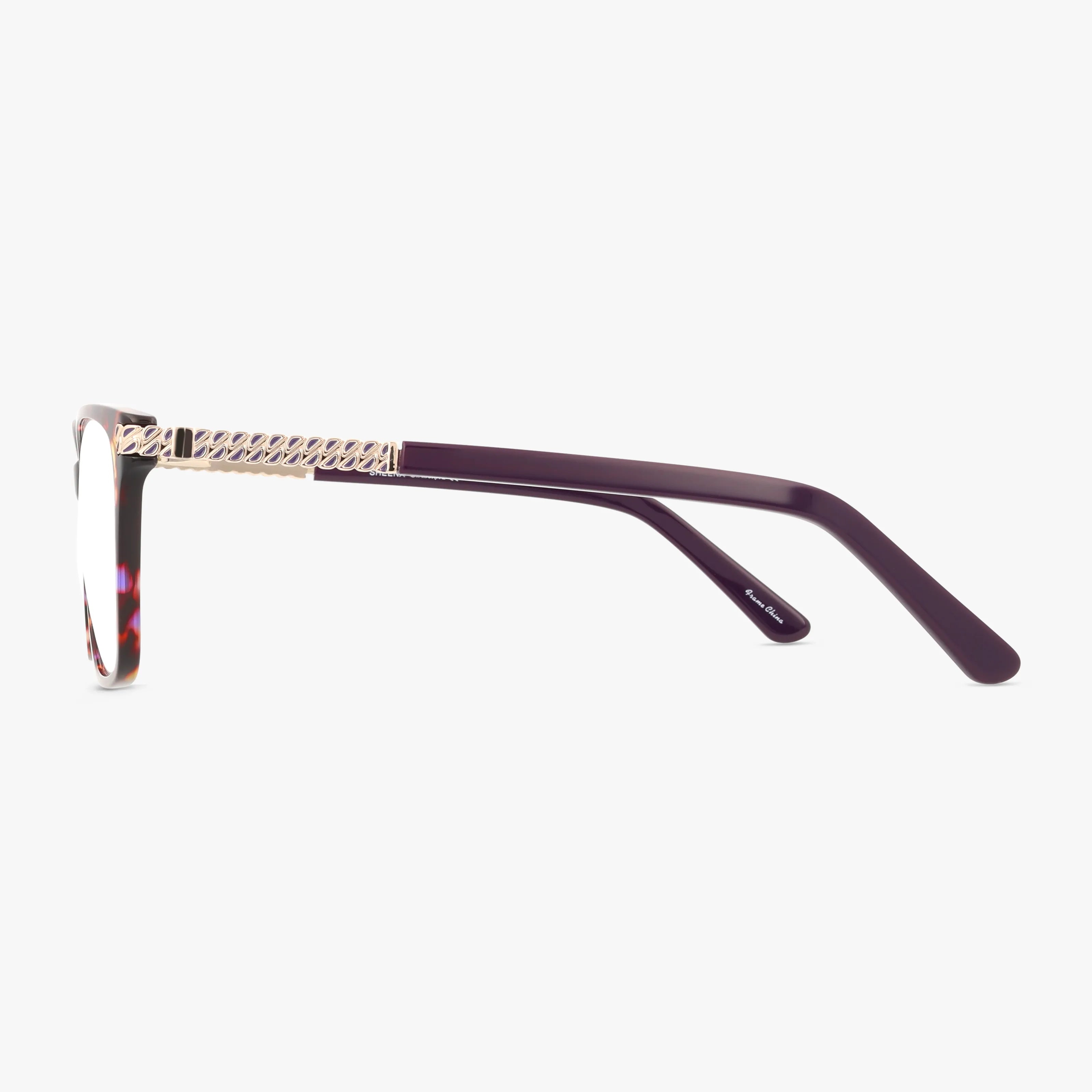 Side view of SHEENA eyeglasses: featuring a purple frame, gold textured detailing on the temple, and clear lenses, photographed against a white background.