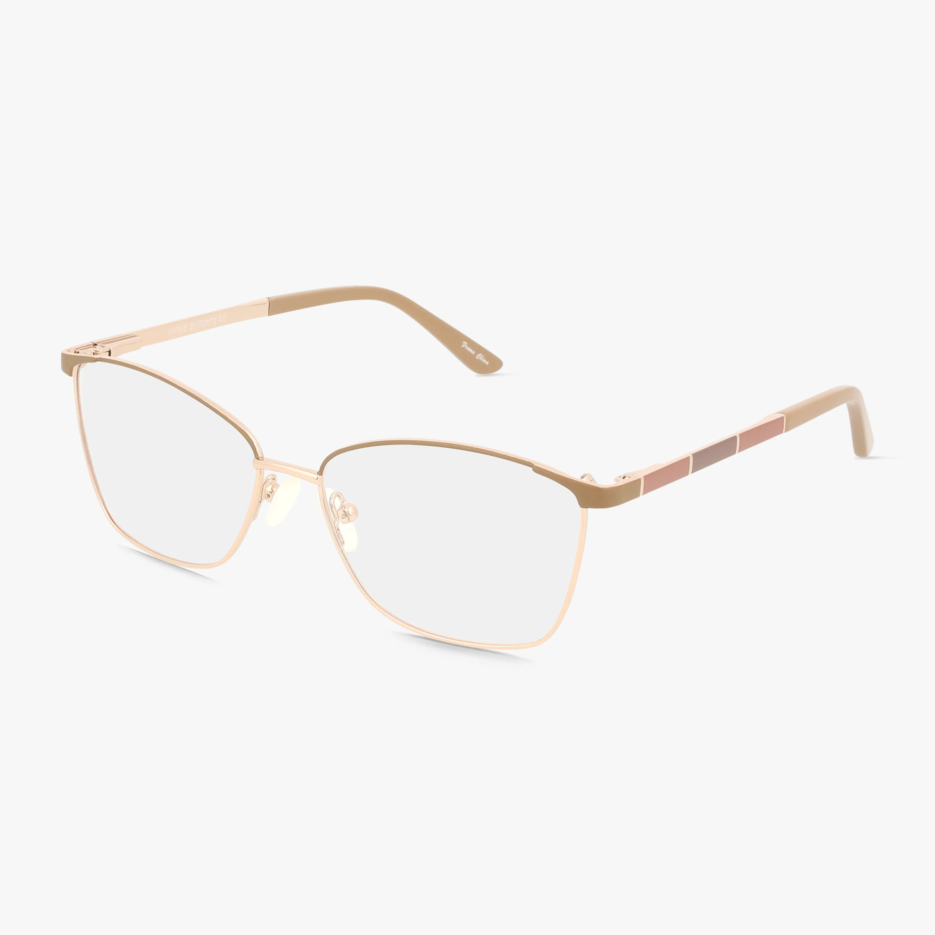 The ANNIE eyeglasses feature a stylish, thin gold metal frame with clear lenses and subtle pink temple accents, offering a contemporary look ideal for daily wear, displayed on a white background.