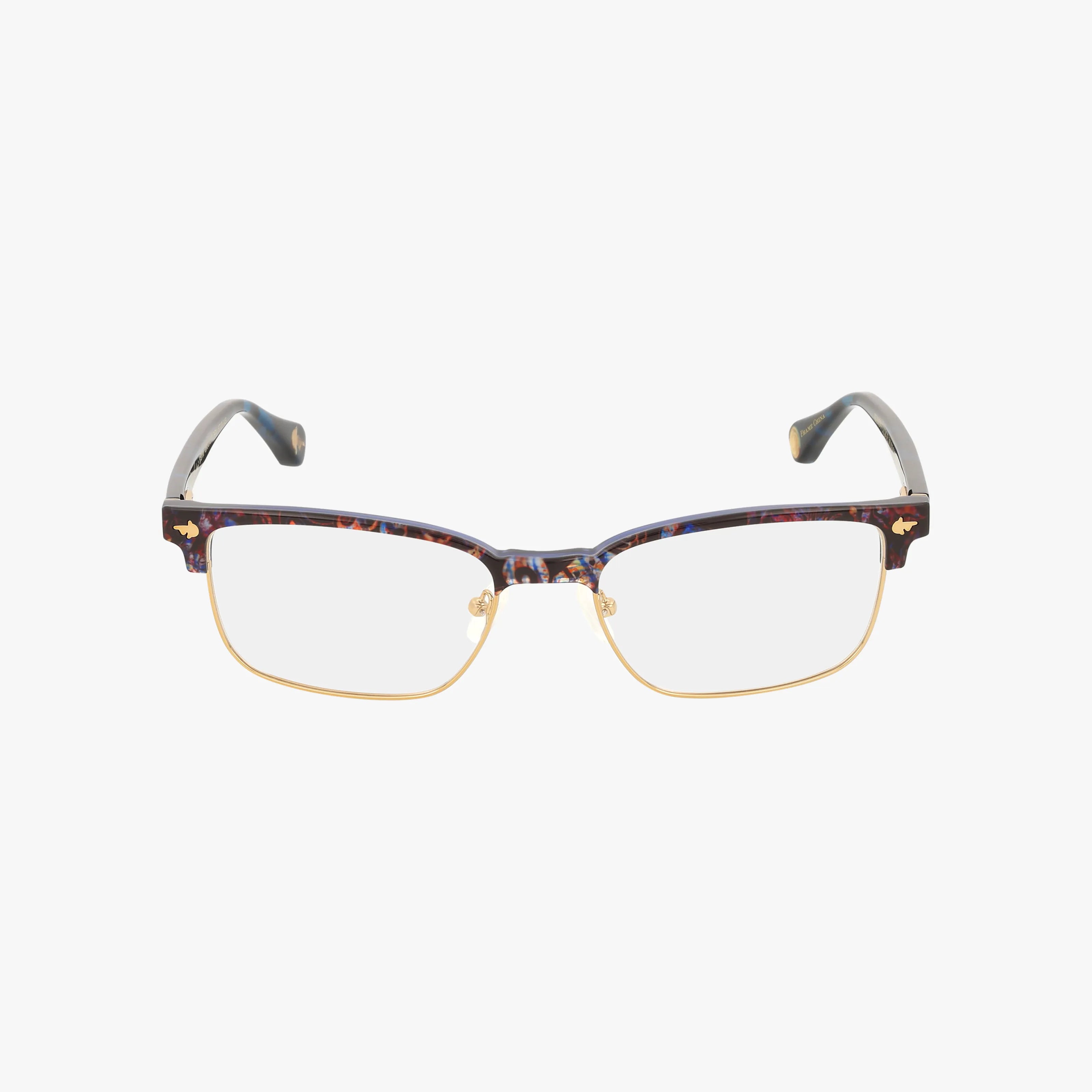 The CROCKETT glasses feature a modern design with a dark, patterned upper frame, gold metal rim and bridge, clear lenses, and dark temple arms, shown against a white background.