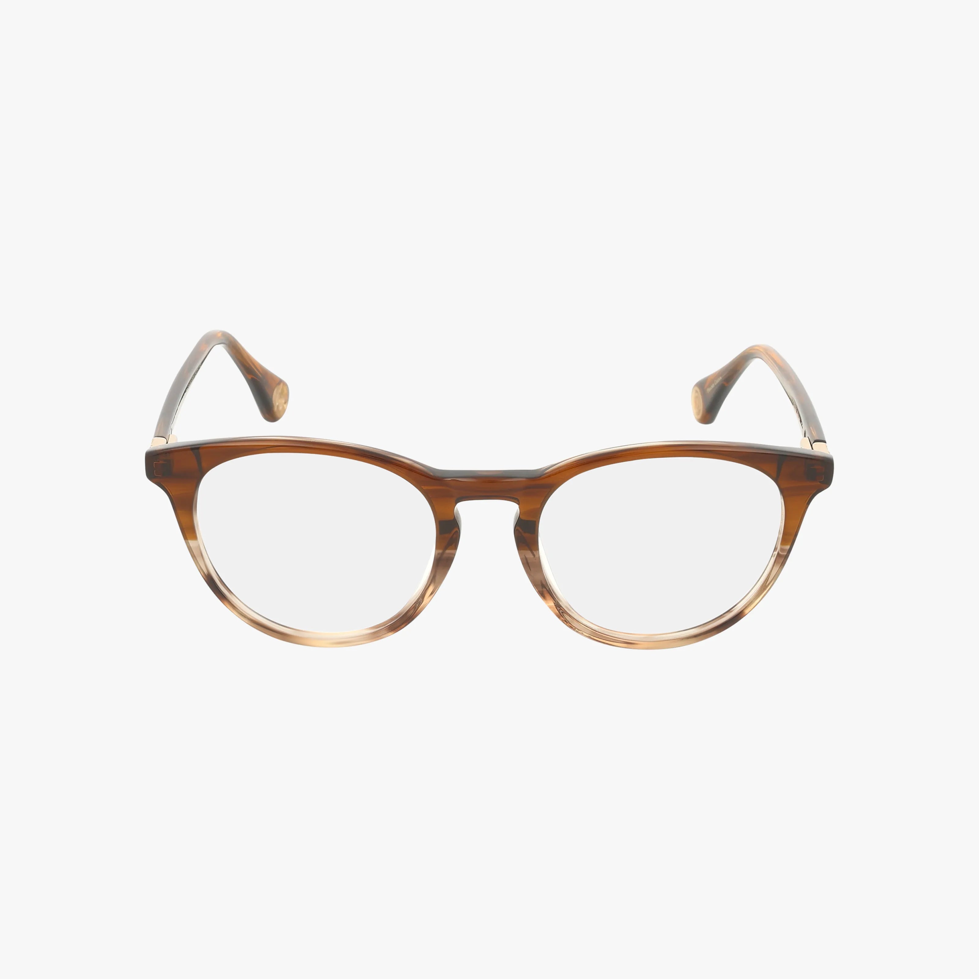 The CASSIAN eyeglasses feature a brown round frame with clear lenses and resilient construction, slightly curved arms, and are displayed against a plain white background.