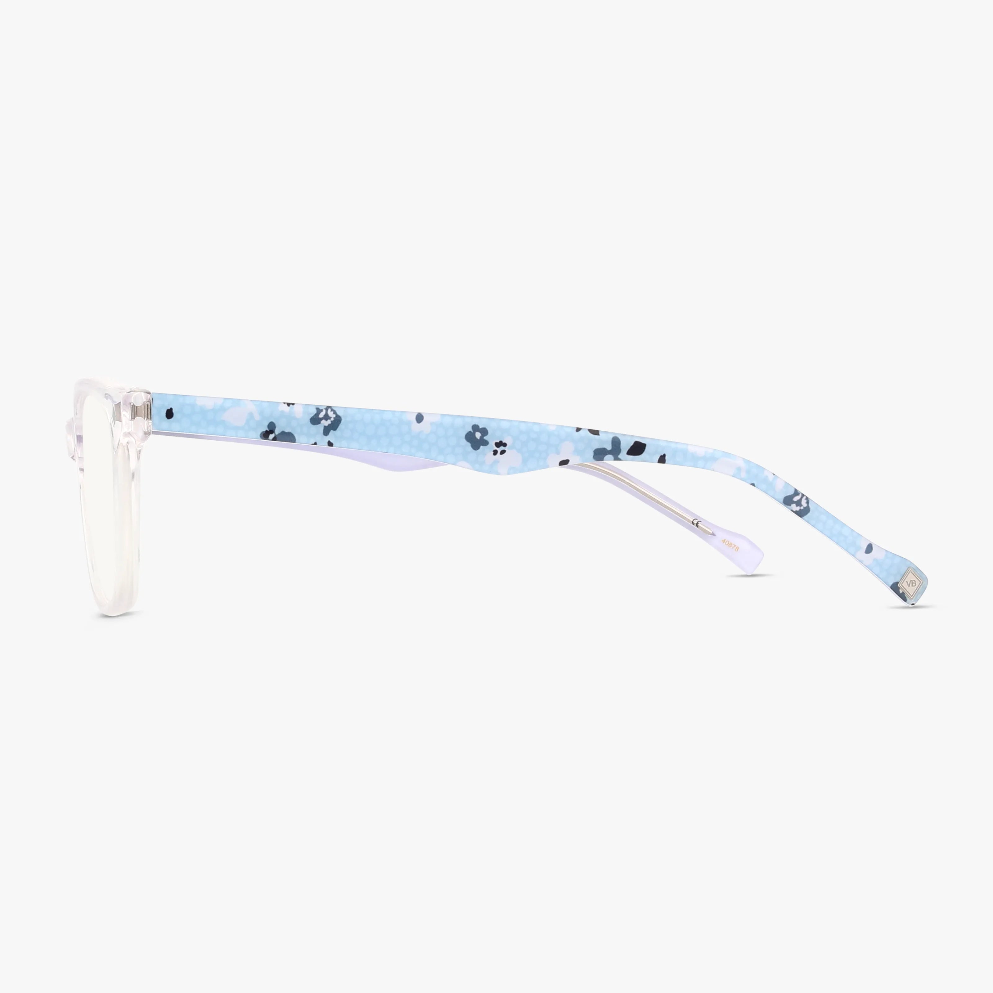 Side view of MERIT eyeglasses with clear front frames and blue patterned arms featuring black and white floral designs—ideal for a sharp, smart look. Displayed on a white background.