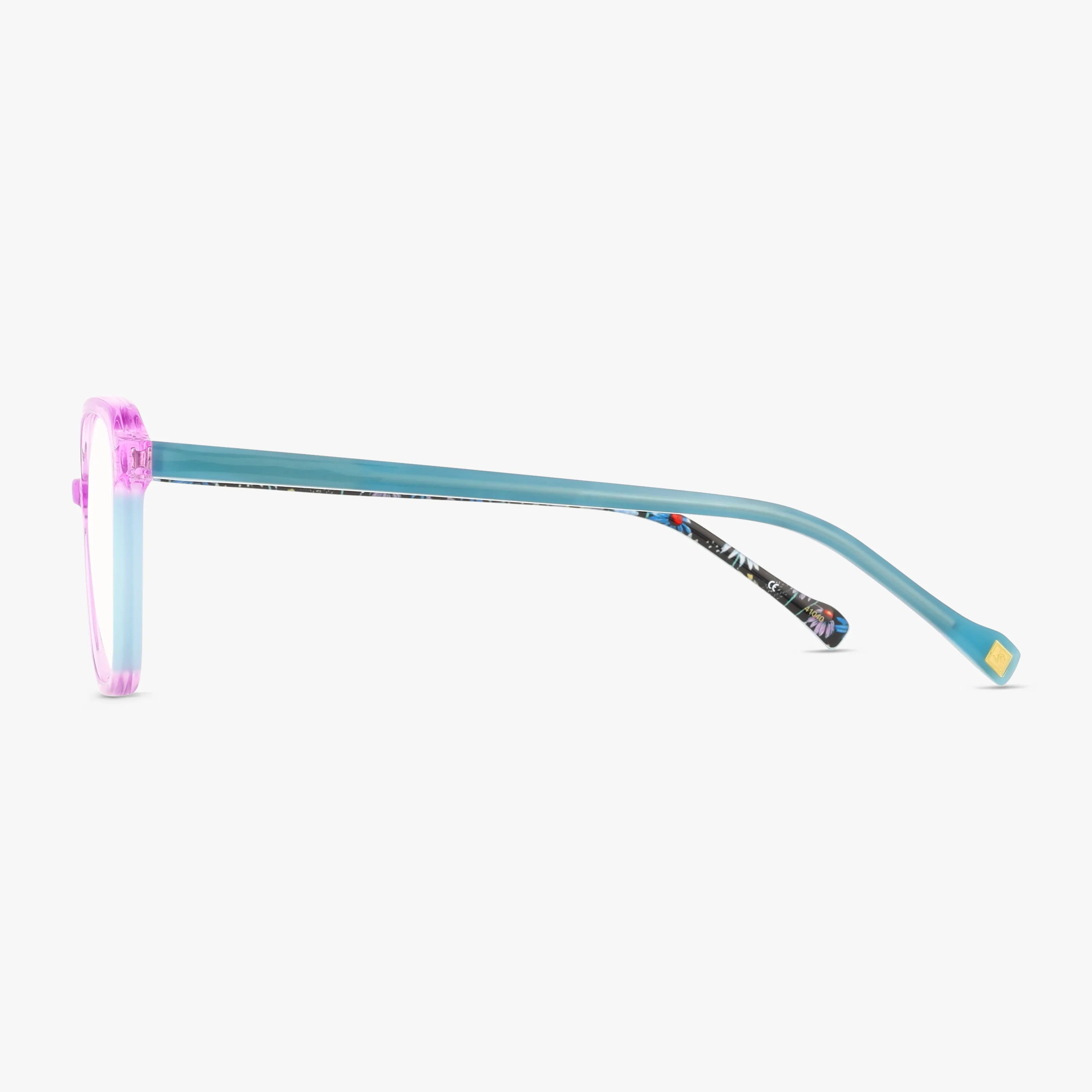 Side view of KIENNA eyeglasses featuring a translucent pink round frame, teal blue arms, and a patterned section near the ear tip—stylishly highlighted against a white backdrop.