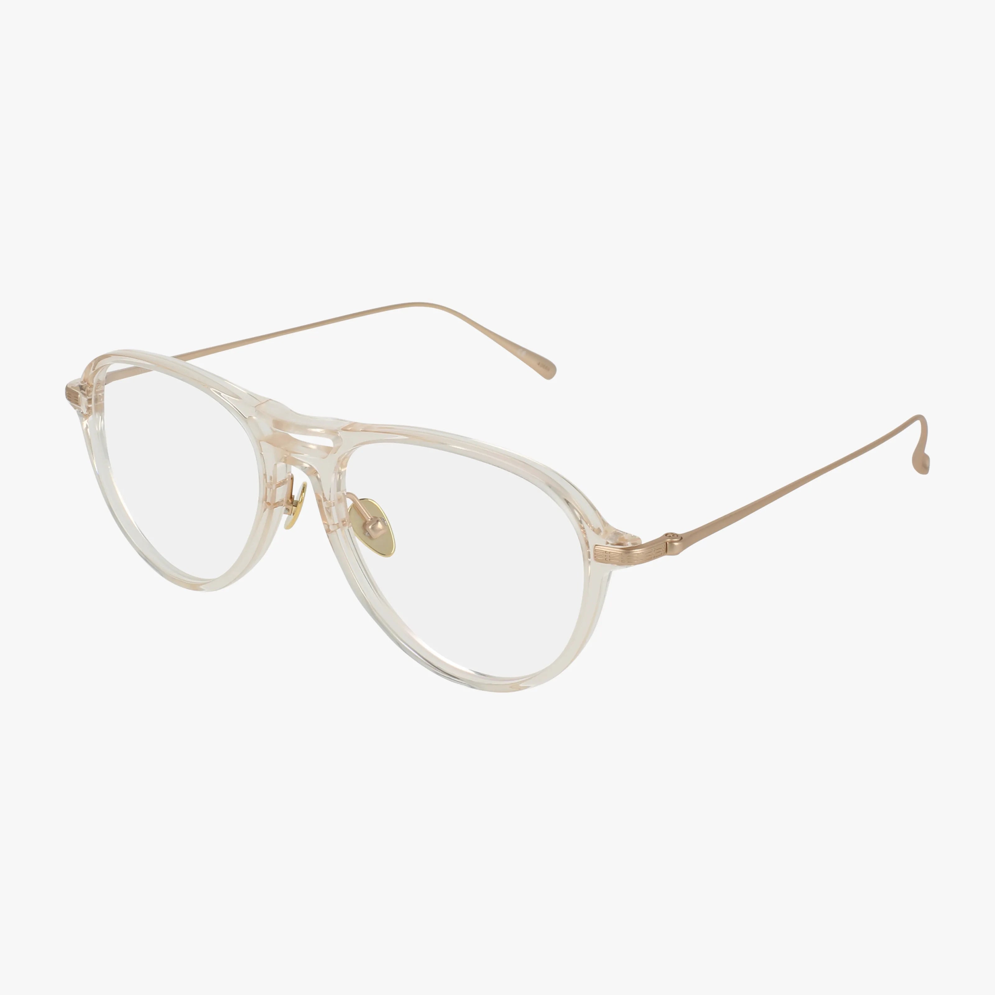 VENTURA clear-framed eyeglasses feature rounded lenses, gold metal temples, and adjustable nose pads, showcased on a white background.