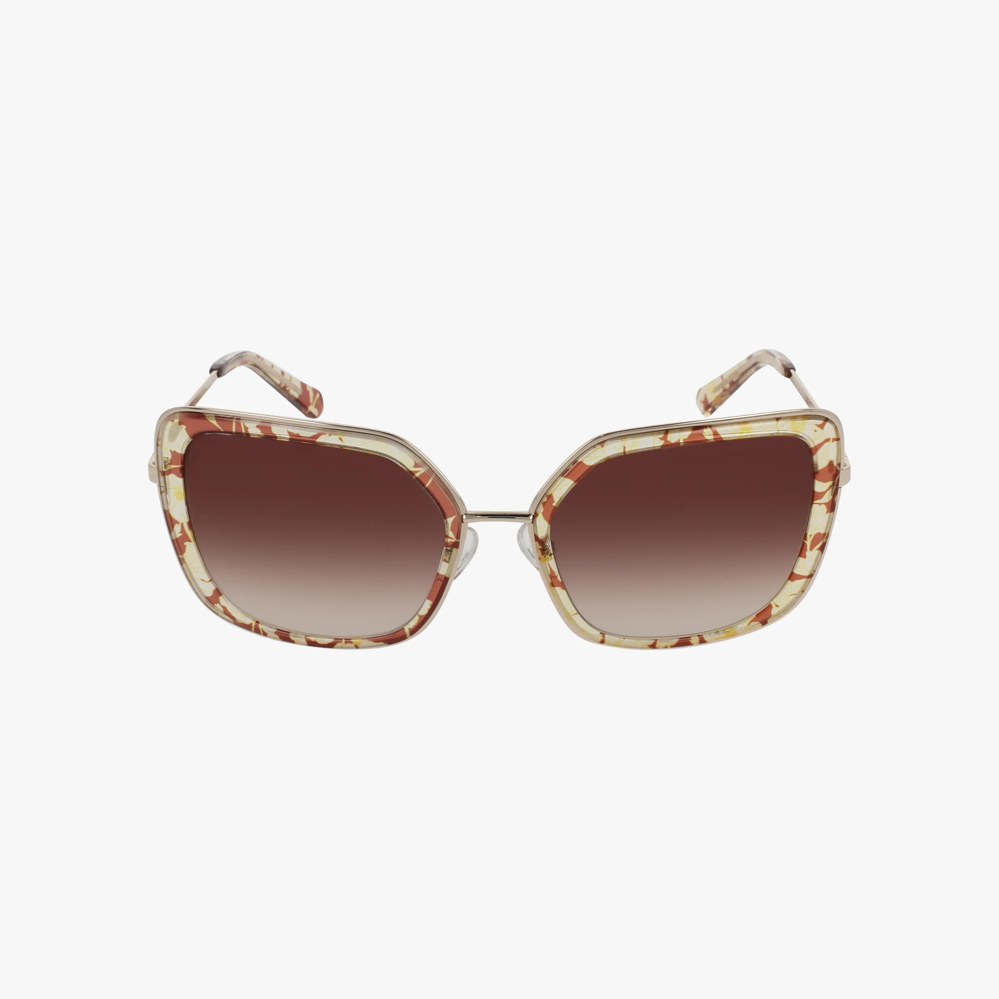 GEORGETTE sunglasses feature oversized, geometric frames in a cream and brown marbled pattern with large gradient brown lenses. Thin metal arms and a nose bridge add a sleek touch to this bold design.