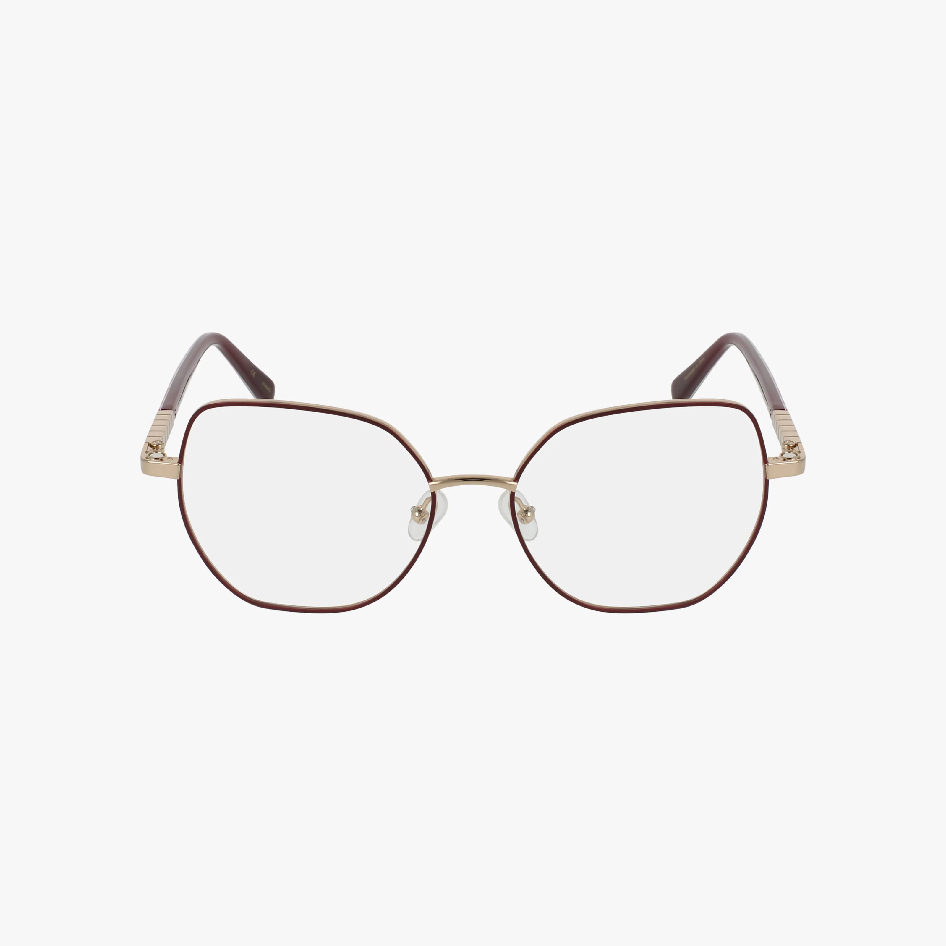 FIORA geometric eyeglasses feature thin brown metal frames with gold accents on the bridge and temples, clear lenses, gently curved temples, and dark tips.