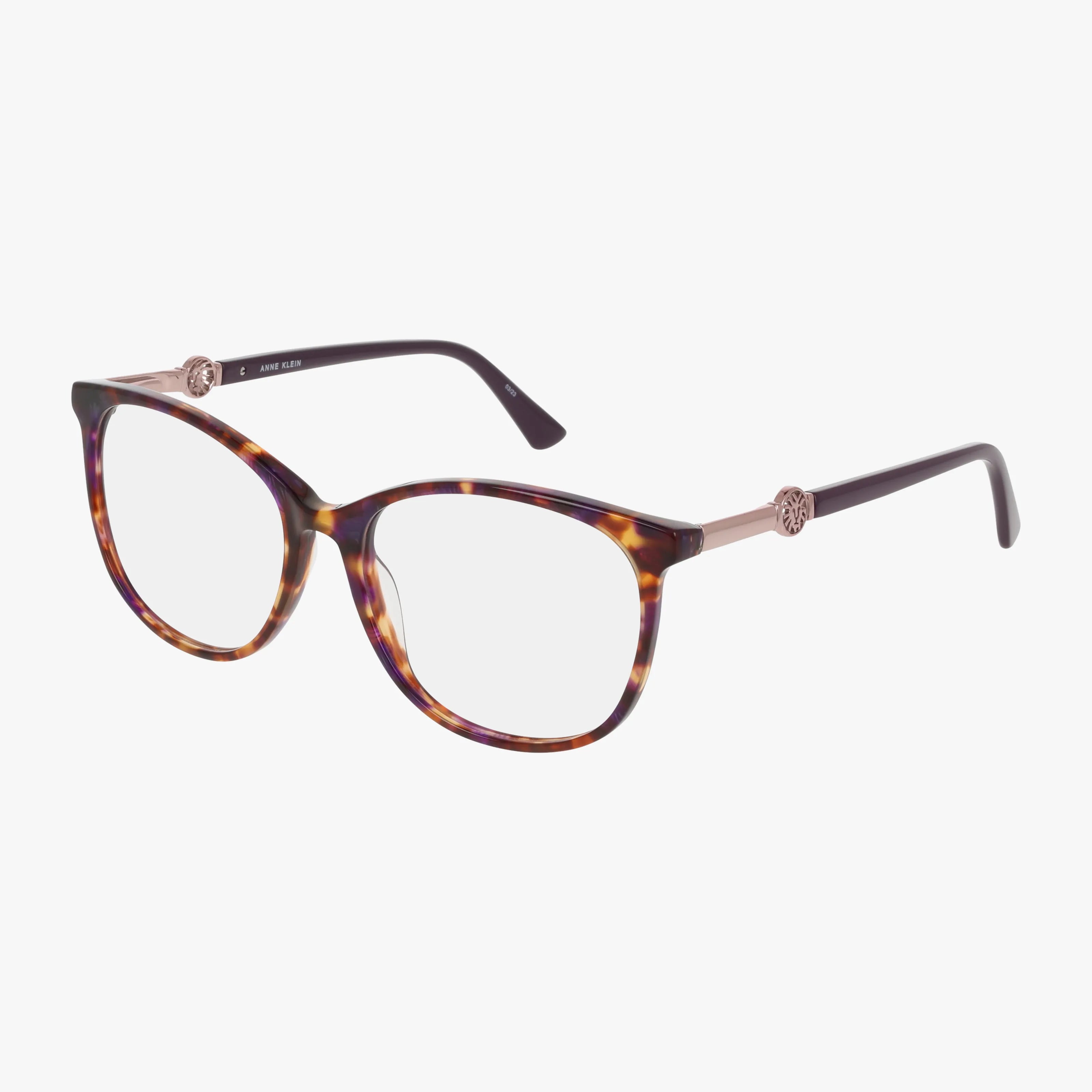 The AK5102 eyeglasses feature round tortoiseshell frames with gold-accented temples, clear lenses, and a subtle cat-eye shape for lasting elegance and timeless style, shown on a white background.