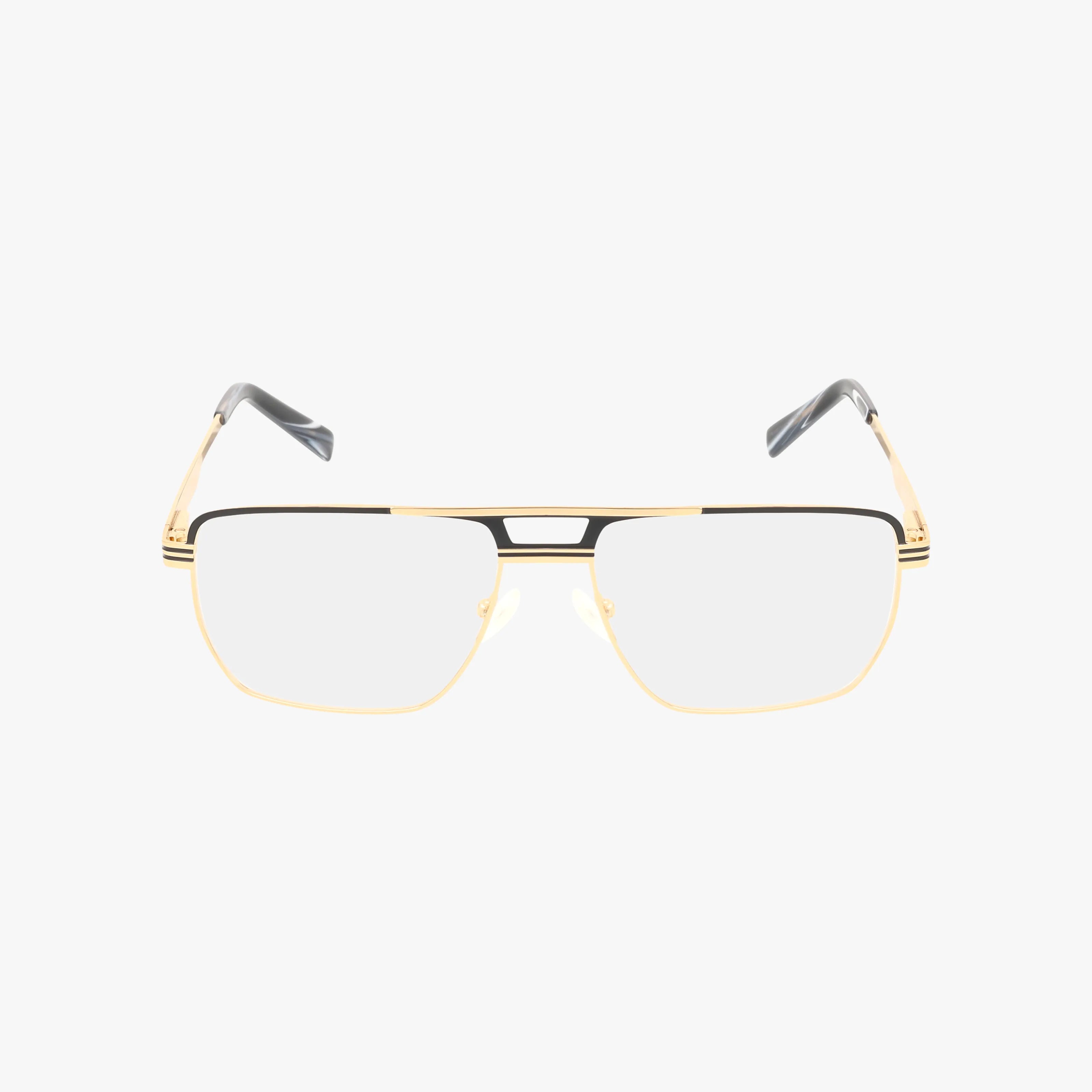The RVMO5158 is a pair of gold and black metal eyeglasses with oversized rectangular frames, clear lenses, black accents on the bridge and temples, striped hinge details, and black tips, all shown on a white background.