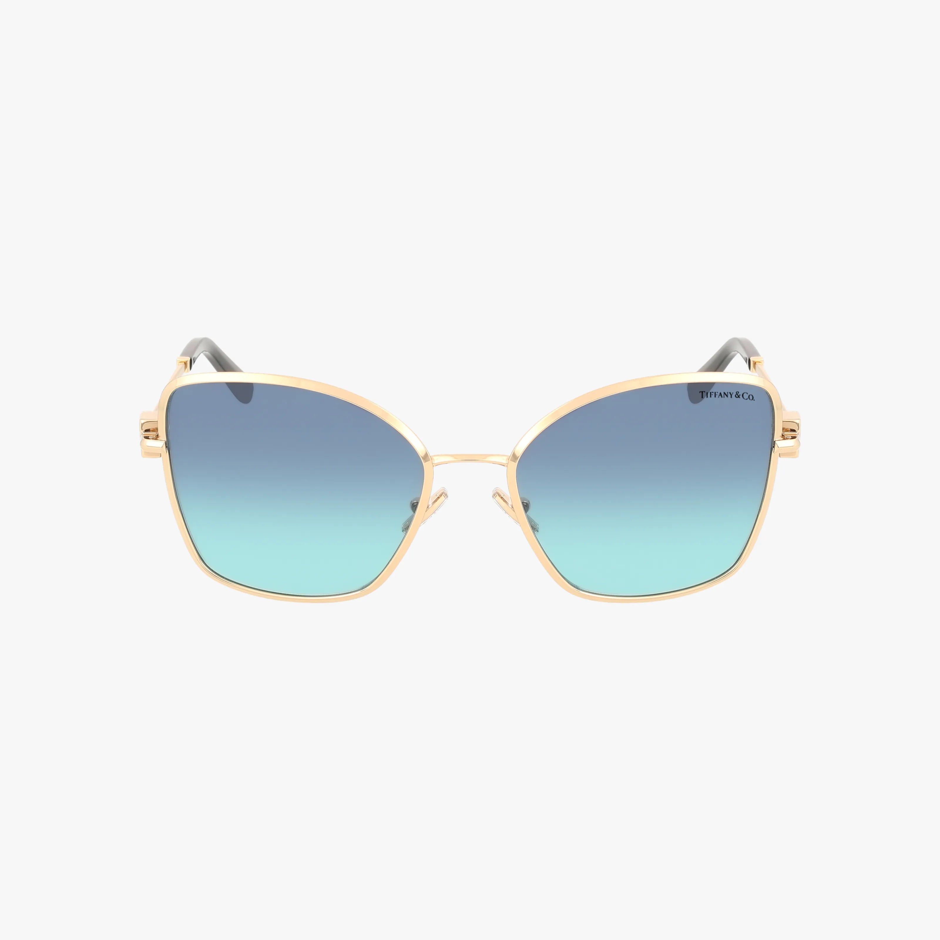 The TF3102B sunglasses feature a gold, lightweight frame with square blue gradient lenses and thin temples, displayed on a white background. The Tiffany & Co. logo is subtly placed on the upper left lens.
