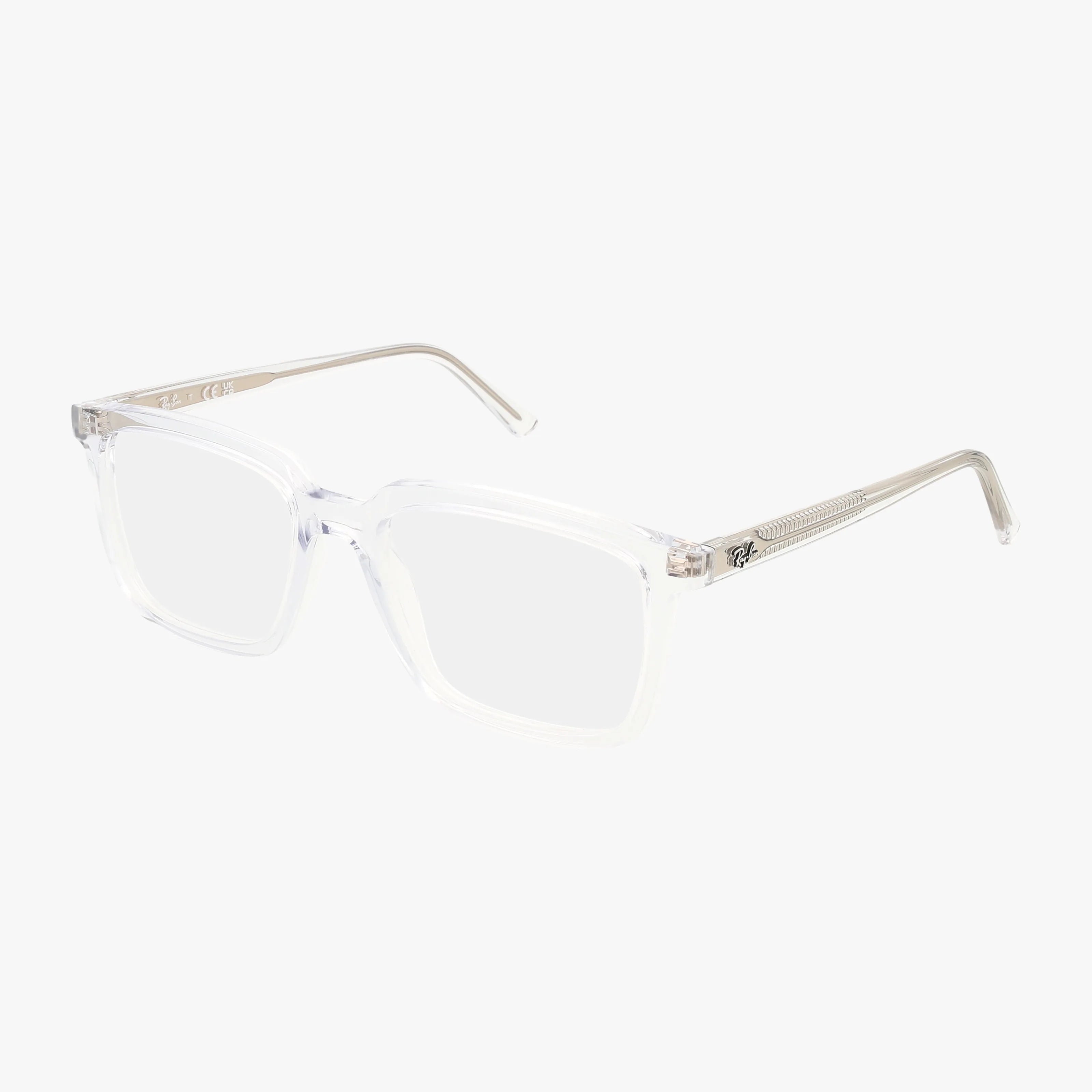 The RX7239 ALAIN by Ray-Ban features clear, rectangular frames with transparent temples and a minimalist, modern look. Shown on a plain white background, these glasses offer sleek style and can be paired with Transitions lenses.
