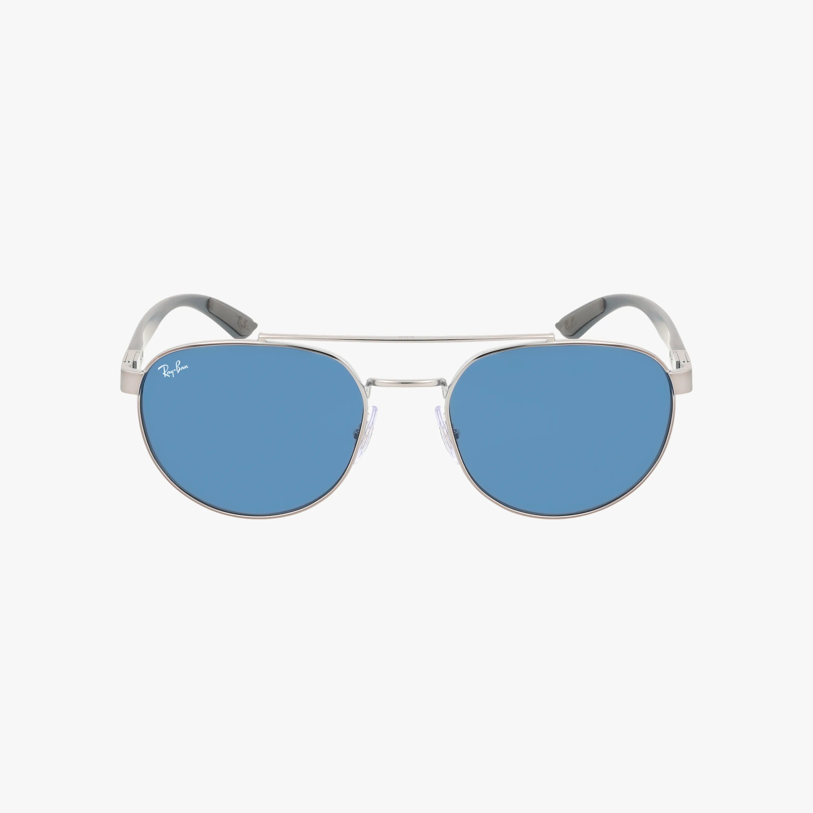Front view of RB3736 silver metal aviator sunglasses with blue tinted lenses and clear nose pads on a white background. Lightweight and timeless, these feature the Ray-Ban logo in white on the top left lens.