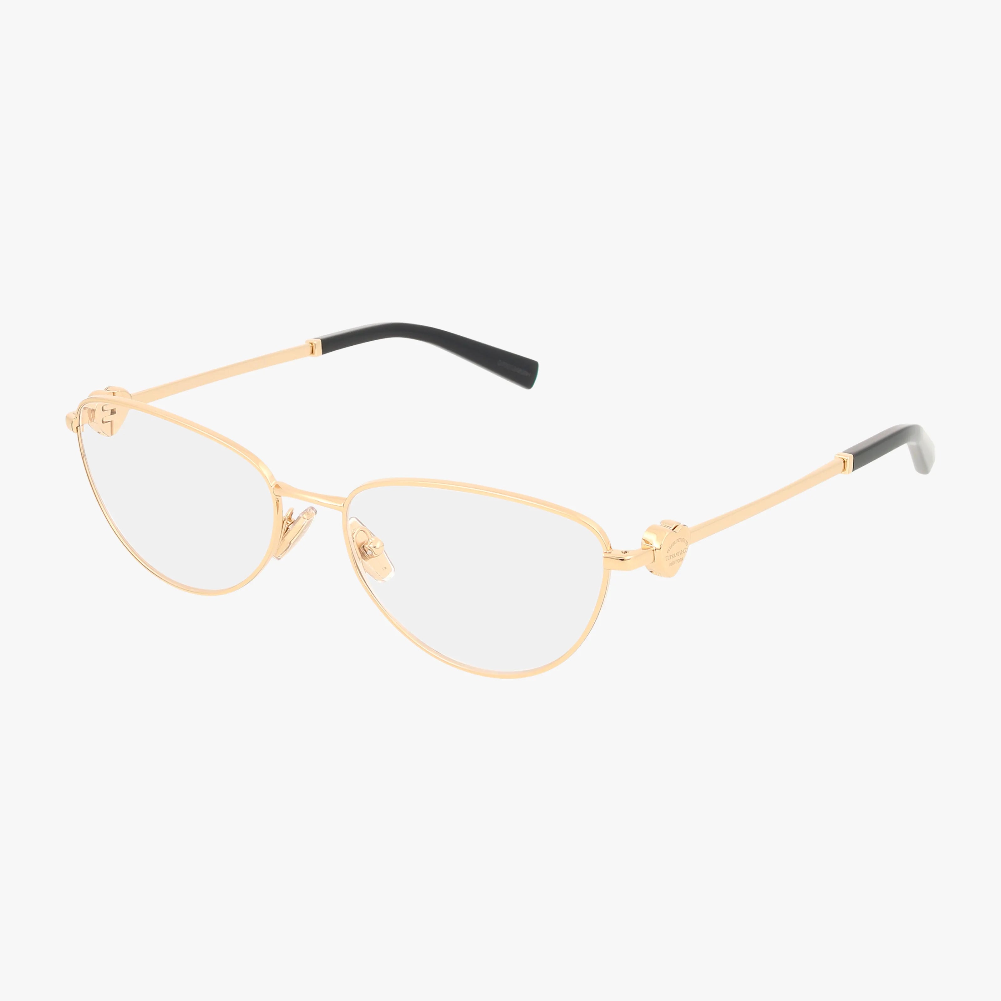 TF1164B gold metal eyeglasses feature a durable frame with a slim oval design and black-tipped arms, shown on a plain white background.