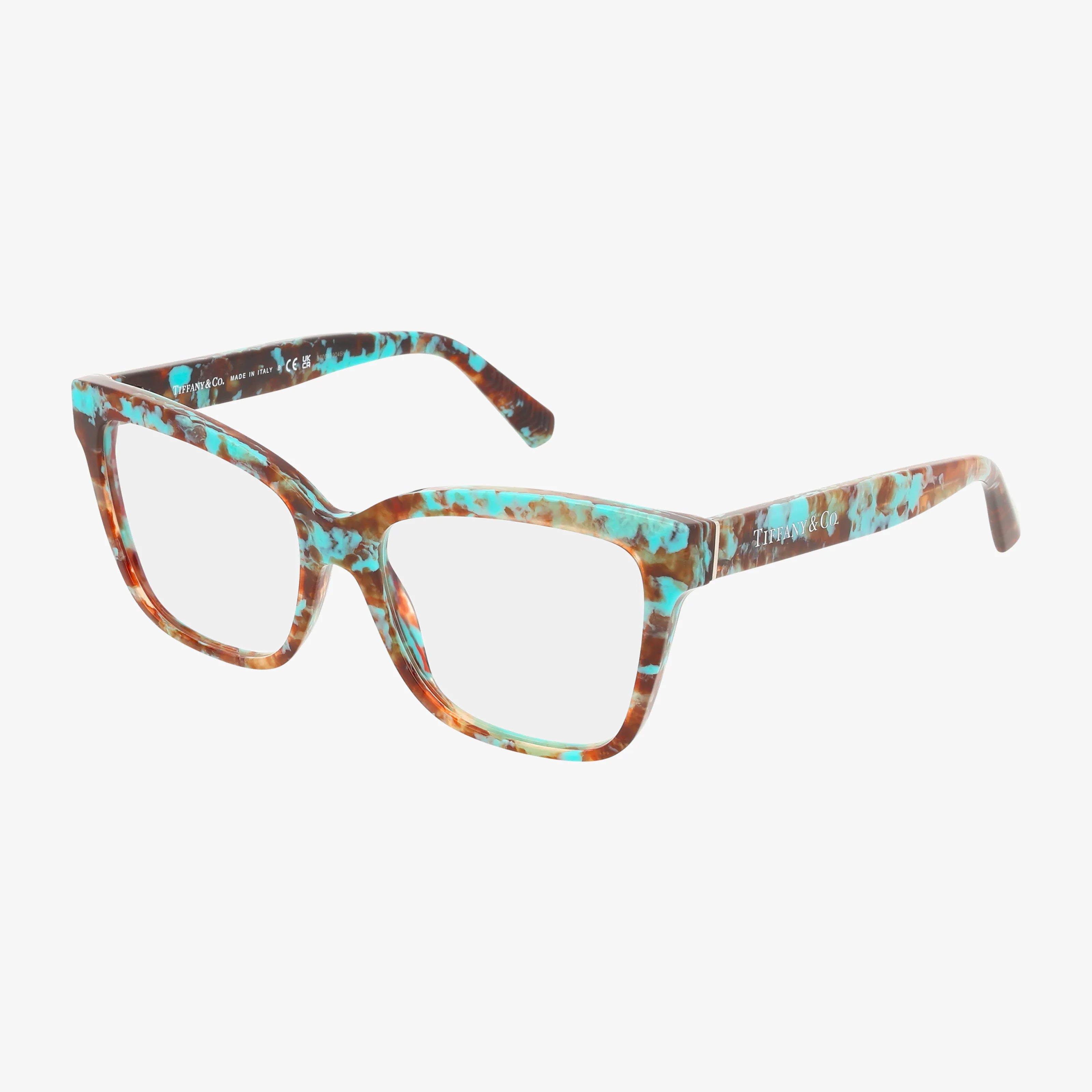 The TF2260 is a pair of rectangular eyeglasses with a marbled turquoise and brown frame, featuring Transitions lenses for style and strength, set against a plain white background.