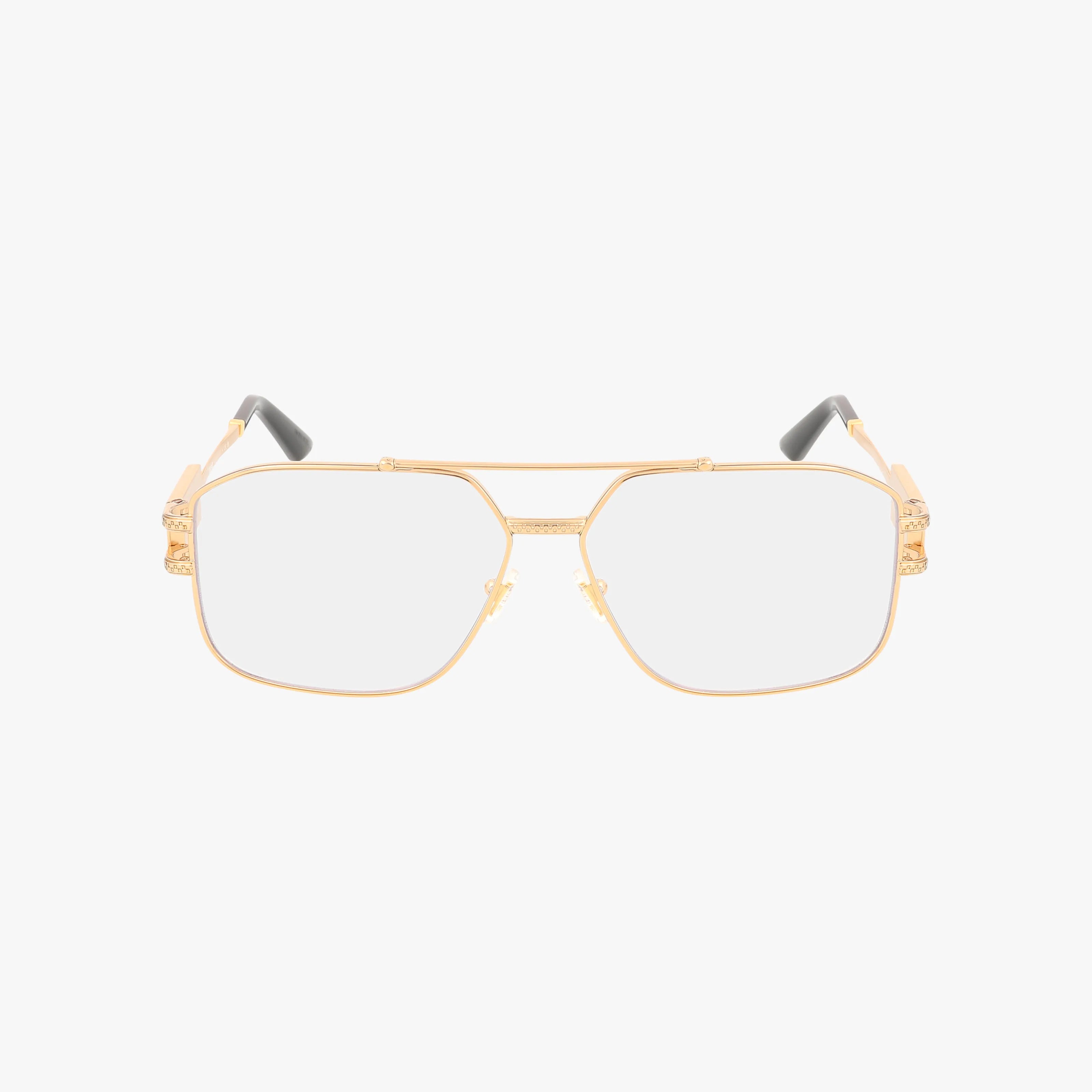 The VE1302 gold metal aviator eyeglasses feature clear blue light lenses, skull hinge accents, and black arm tips. Lightweight and durable, these stylish frames are shown on a white background.