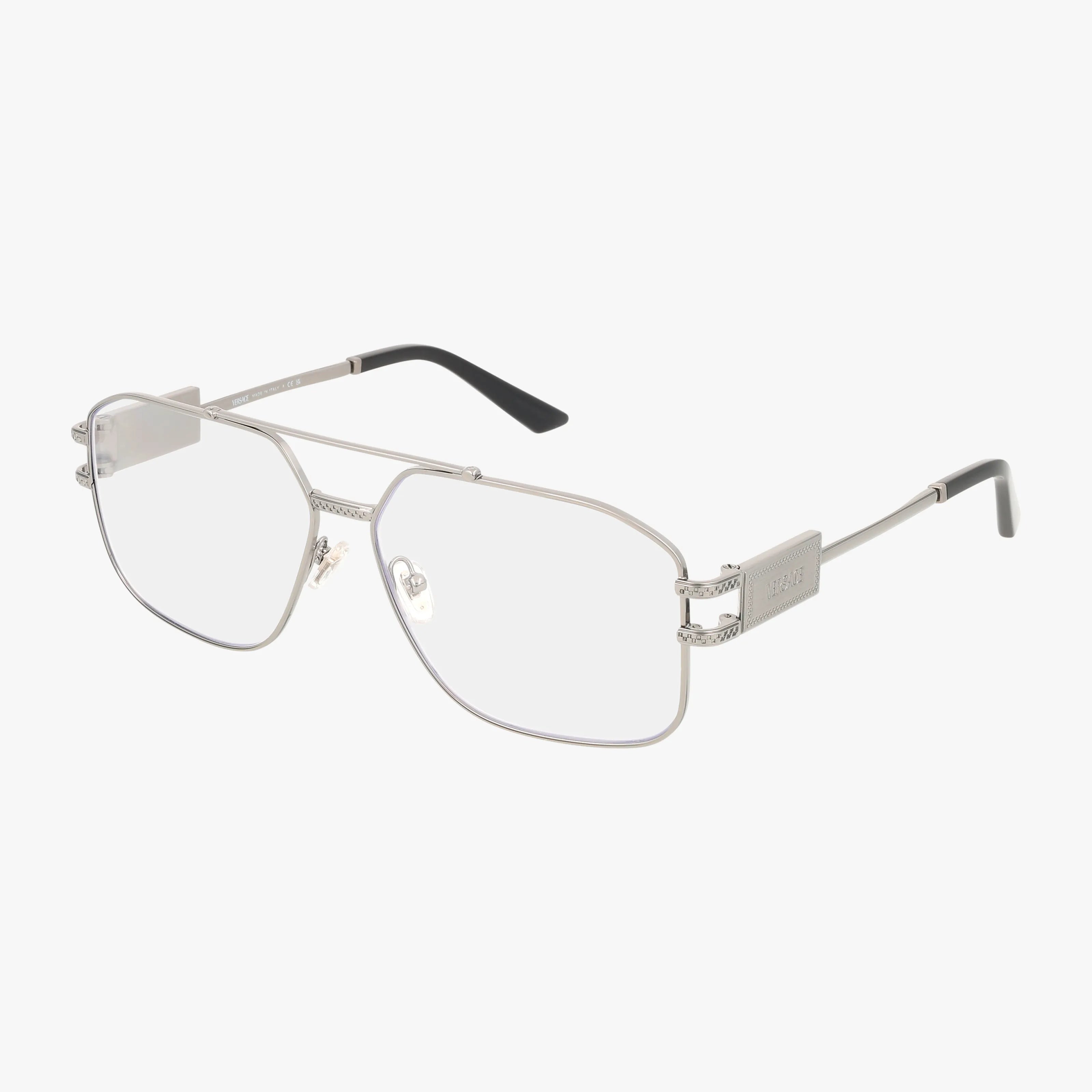 The VE1302 features silver metal aviator frames with blue light lenses, black temple tips, and decorative hinge and arm details. Lightweight design is displayed against a white background.