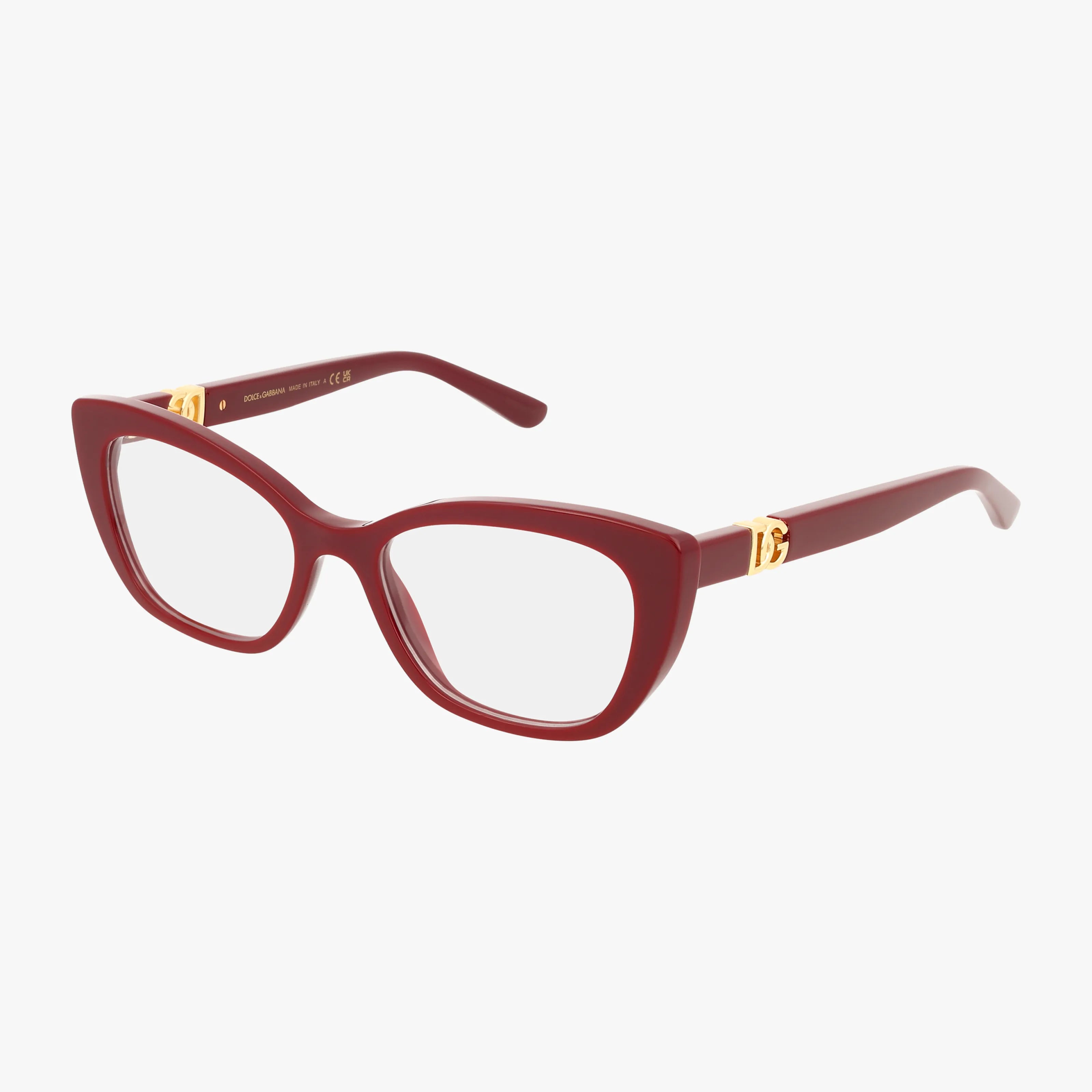 The DG3398 features cat-eye eyeglasses with bold, glossy red frames and clear lenses. Lightweight for comfort, they are accented by gold emblems near the hinges to highlight quality craftsmanship, set against a plain white background.