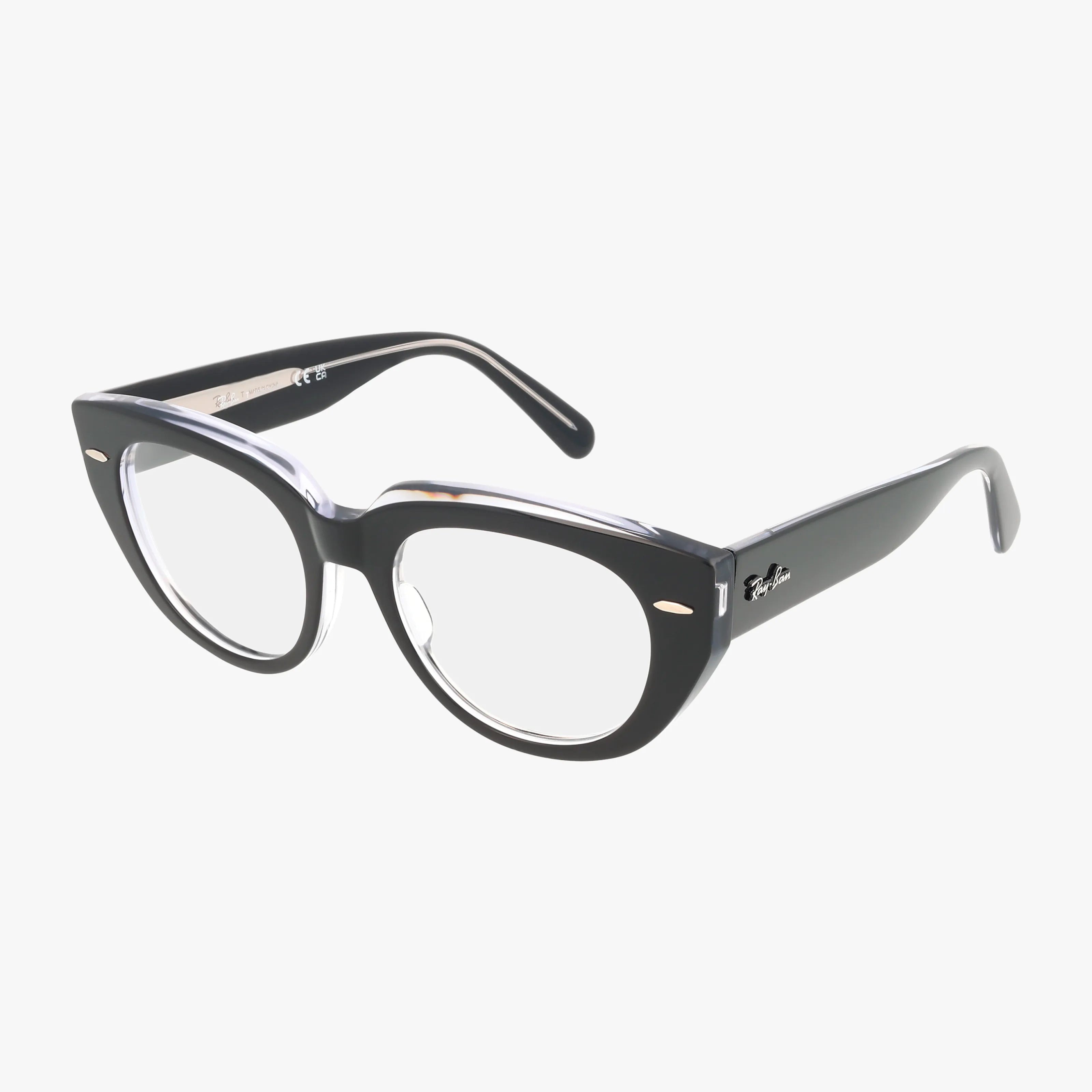 The RX5586 features black cat-eye frames with clear prescription lenses, thick and versatile construction, small silver corner accents, and a logo on the arms, shown against a white background.