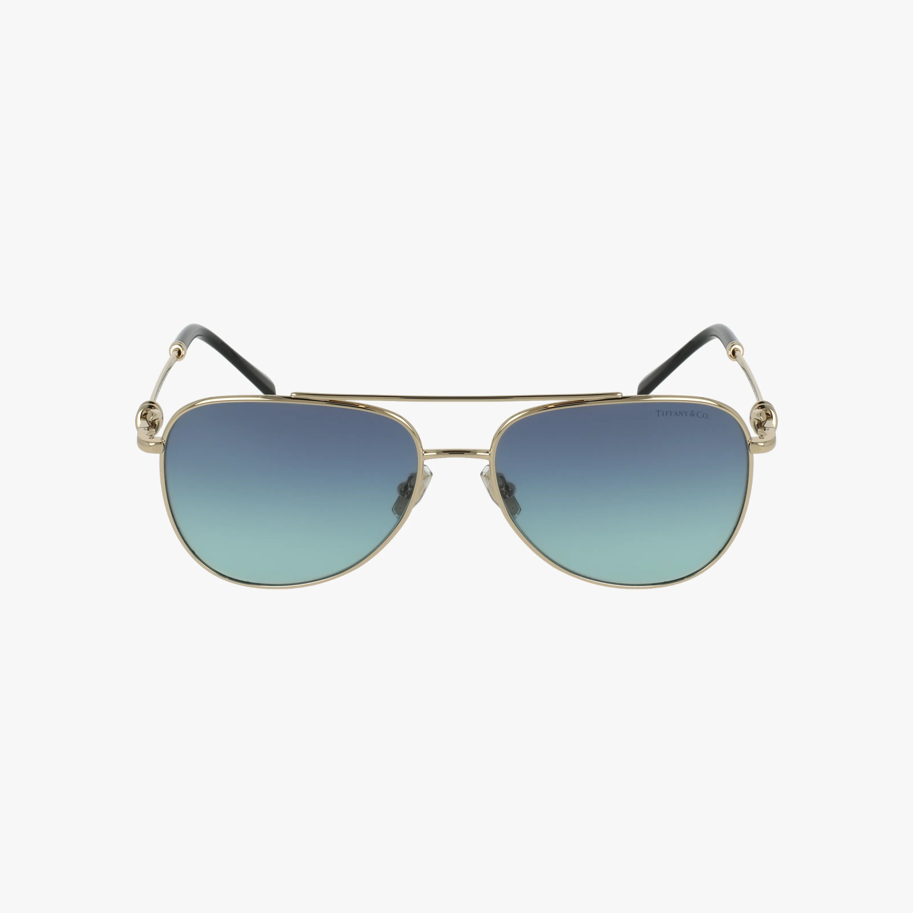 TF3116 gold-framed aviator sunglasses featuring blue gradient lenses and black earpieces, shown on a plain white background.