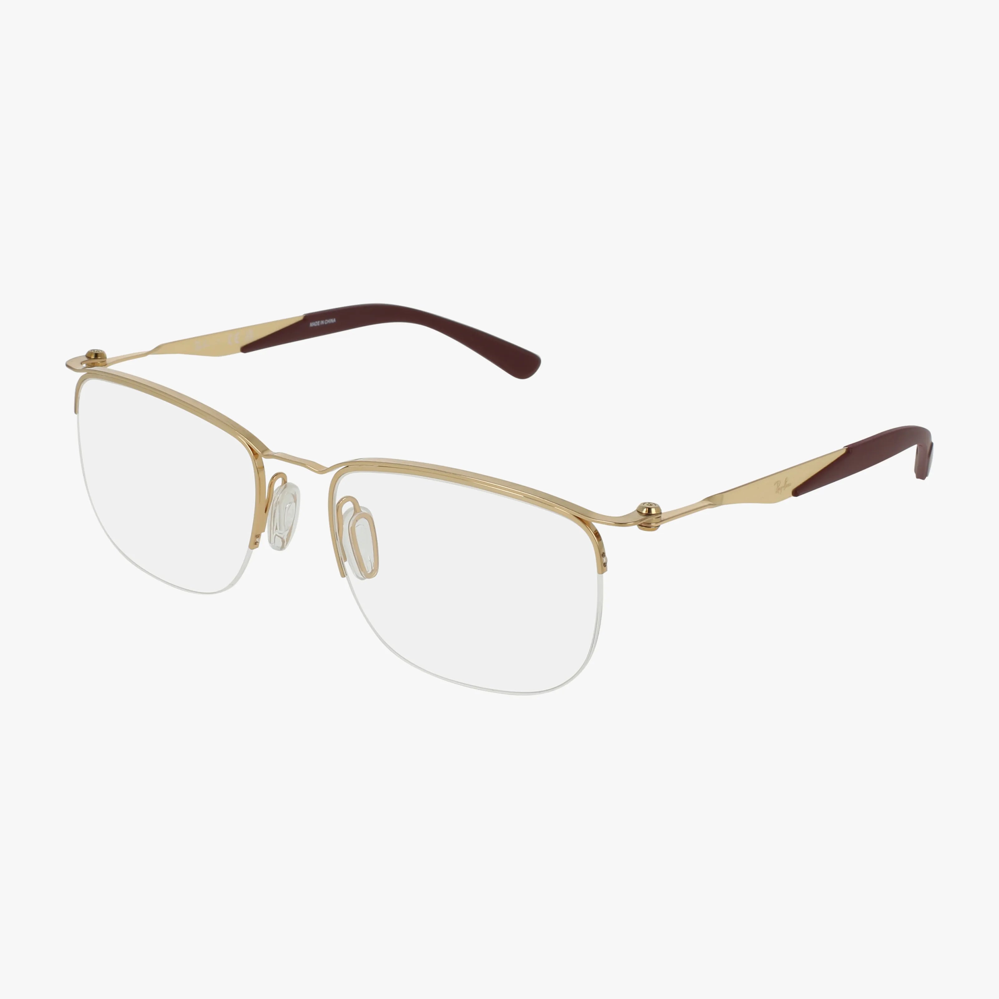 The RX7552 is a gold, semi-rimless eyeglass frame with rectangular clear lenses, adjustable nose pads, and brown temple tips, displayed on a white background.
